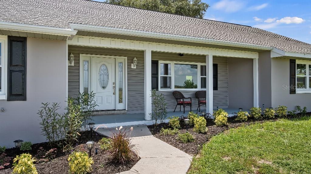 BRAND NEW ROOF!!!
Welcome to this stunning, fully renovated home located on over 2.6 acres of picturesque land with breathtaking views of Lake Yale. This fantastic property boasts a prime location just minutes away from shopping and recreational activities such as the Marsh Memorial Park and Boat Ramp. Step inside this beautifully updated home and be captivated by the luxurious finishes throughout. The large family room features a centerpiece fireplace, creating a cozy atmosphere for chilly evenings. The modern kitchen is fully equipped with brand new cabinets, stunning granite countertops, and top-of-the-line appliances. The spacious master bedroom comes complete with a walk-in closet, providing ample storage space. The second bedroom, located upstairs, faces the lake and features its own full bathroom. Enjoy the picturesque views from the front porch, which overlooks the sparkling waters of Lake Yale. Relax on the 12x28 screened-in porch, which provides plenty of space for entertaining guests or unwinding after a long day. The expansive backyard offers enough room to build your dream pool and create your own private oasis. This fantastic home also features fresh paint, all-new premium windows, bathrooms, and flooring - the list goes on! A new water heater and new AC unit downstairs provide added convenience and comfort. Plus there is NO HOA. Located just minutes from major highways including 429, 441, and 46, and only 19 minutes from charming downtown Mount Dora, this home is perfect for those seeking both convenience and luxury.