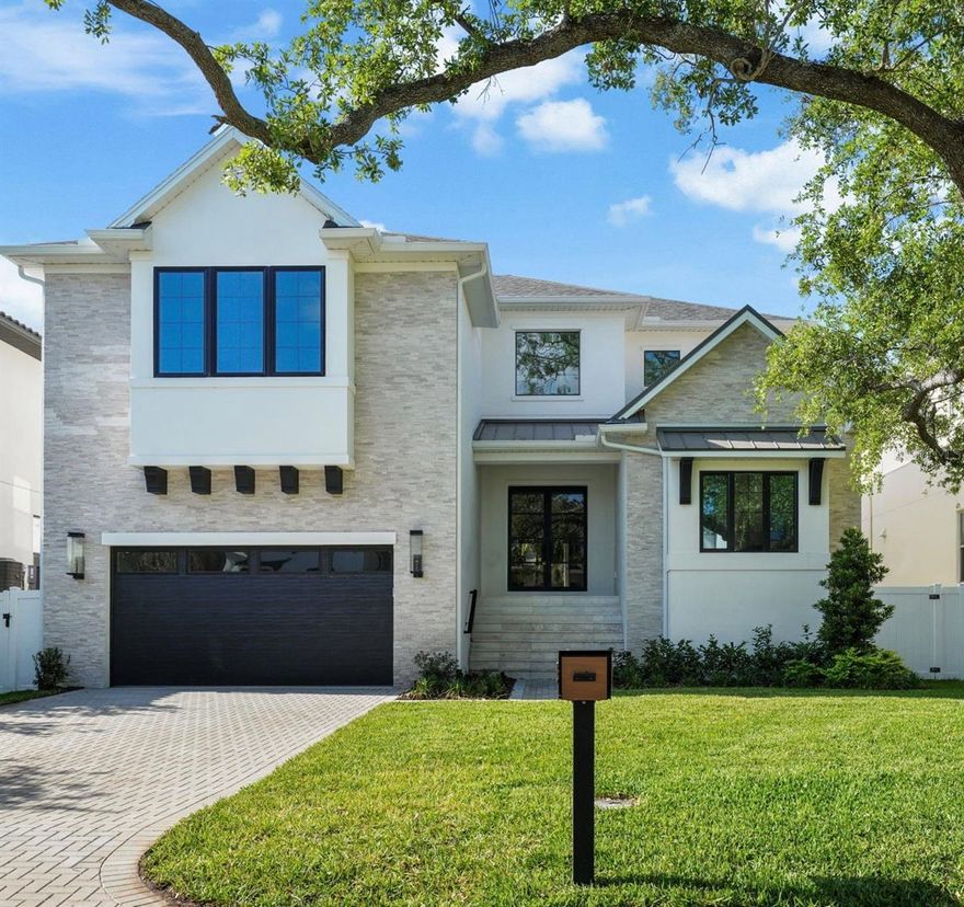 MOVE-IN READY!  Your search for new construction is over!  5024 W Dickens is an amazing opportunity to own a BRAND NEW home with a custom feel. Exceptionally built by Gloger Construction, this home not only looks fabulous with its clean lines and warm, natural elements. But reflects the outstanding quality, synonymous with Gloger’s work. Thanks to its reinforced ALL-BLOCK construction, level 4 drywall application, wood tongue and groove exterior ceilings, and impact resistant doors and windows, the finishes on this home rival most custom designs. The quality of construction and attention to detail are apparent from the moment you open the impressive wrought-iron and glass double doors.  Note the high ceilings, open floor plan, solid core doors, 10" wide-plank wood flooring and clean site line to the covered lanai and pool. There is a generator too!  To your right, is the study with exceptional millwork on the cathedral ceiling.  To your left, is the entry to the mud room and a butler's pantry with a THERMADOR 24” wine fridge, sink and showcase cabinetry. The mudroom features storage cubbies and a secondary washer and dryer hook-up.  But the true gem of this home is the spacious, hidden, working pantry!  It features a second dishwasher and fridge, plenty of prep and storage space too.  You can access it from the mud room or open the faux cabinet door in the main kitchen for easier access.  Close it off and all the clutter is hidden from view!  Chefs, prepare to be impressed with the expansive kitchen! Features include custom cabinetry, quartz countertops, ample storage, and an impressive island with a waterfall counter.   The appliances are all THERMADOR and include a side by side, paneled fridge and freezer, gas cooktop, two built-in ovens, microwave and paneled dishwasher. The kitchen overlooks the large dining room and spacious family room.  Its focal point is textured tile gas fireplace that is sure to impress.  Want to entertain outside? Open your wall of sliders to the pavered lanai and outdoor kitchen with oversized grill, beverage fridge and sink. Or enjoy a dip in your saltwater pool and spa! Back inside, guests will appreciate the private bedroom and full bath tucked away from the rest of home.  Just when you thought there was nowhere else to entertain, head upstairs!  There is a fabulous bonus room with a half bath and space for a pool table, media room or hang out.  The secondary bedrooms all have full baths and custom closets.  At the end of the hall, through the double doors, is your private sanctuary.  The primary suite offers a feature wall and incredible space.  There are two enviable walk-in closets with custom shelving.  The bathroom offers separate vanities, a soaking tub, a walk-in shower and marble throughout.  A large laundry room completes the second floor.  The finishes on this home are exceptional and provide the perfect back drop for personalization.  Convenient to Tampa International Airport,  downtown Tampa and St. Pete.  Zoned for A rated schools (Dale Mabry Elementary, Coleman Middle and Plant High), the only thing missing is you!  Schedule your showing today!