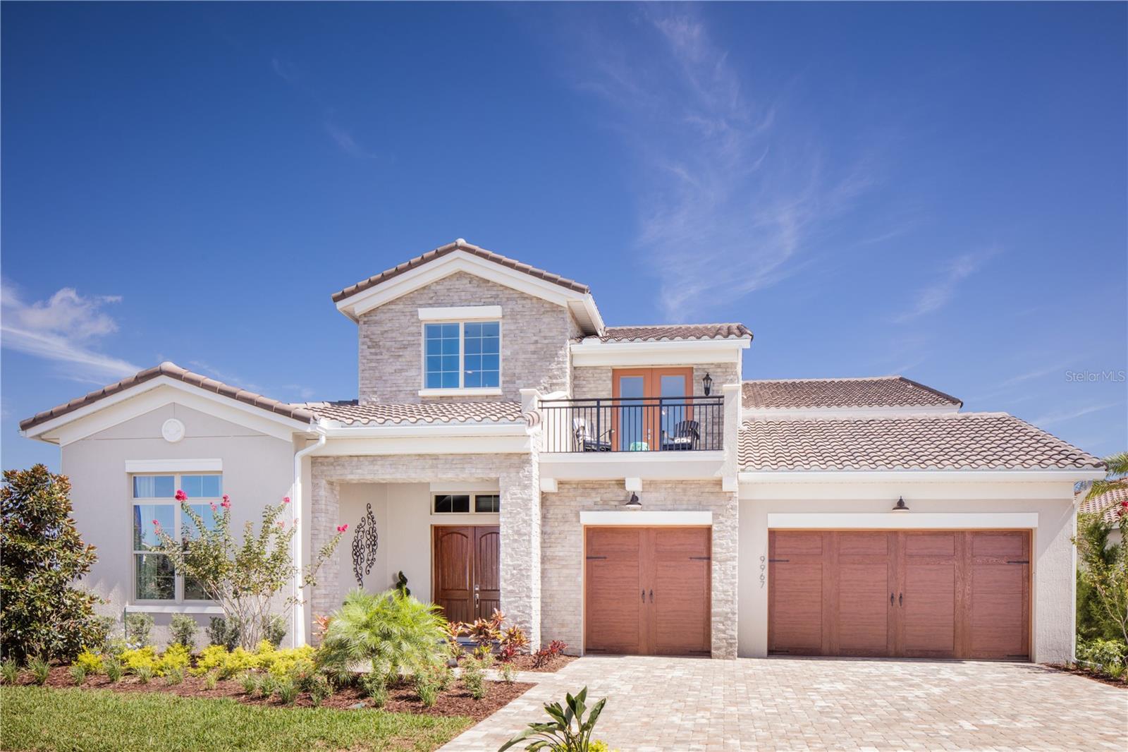 Previously a model home never lived in, this home has all the upgrades! Set on an oversized lot with water and golf views this Ponte Vedra floor plan by Jones homes has everything you are looking for. The ultimate home to entertain your friends and family with over 5600 sq ft including 5 bedrooms and 5 bathrooms with an oasis for a backyard. As you walk into the vaulted entryway you see your very own built in wine cellar. This home was designed with so many custom features including a full wet bar upstairs, sauna, gym, outdoor kitchen. Make your appointment today to see this amazing property.