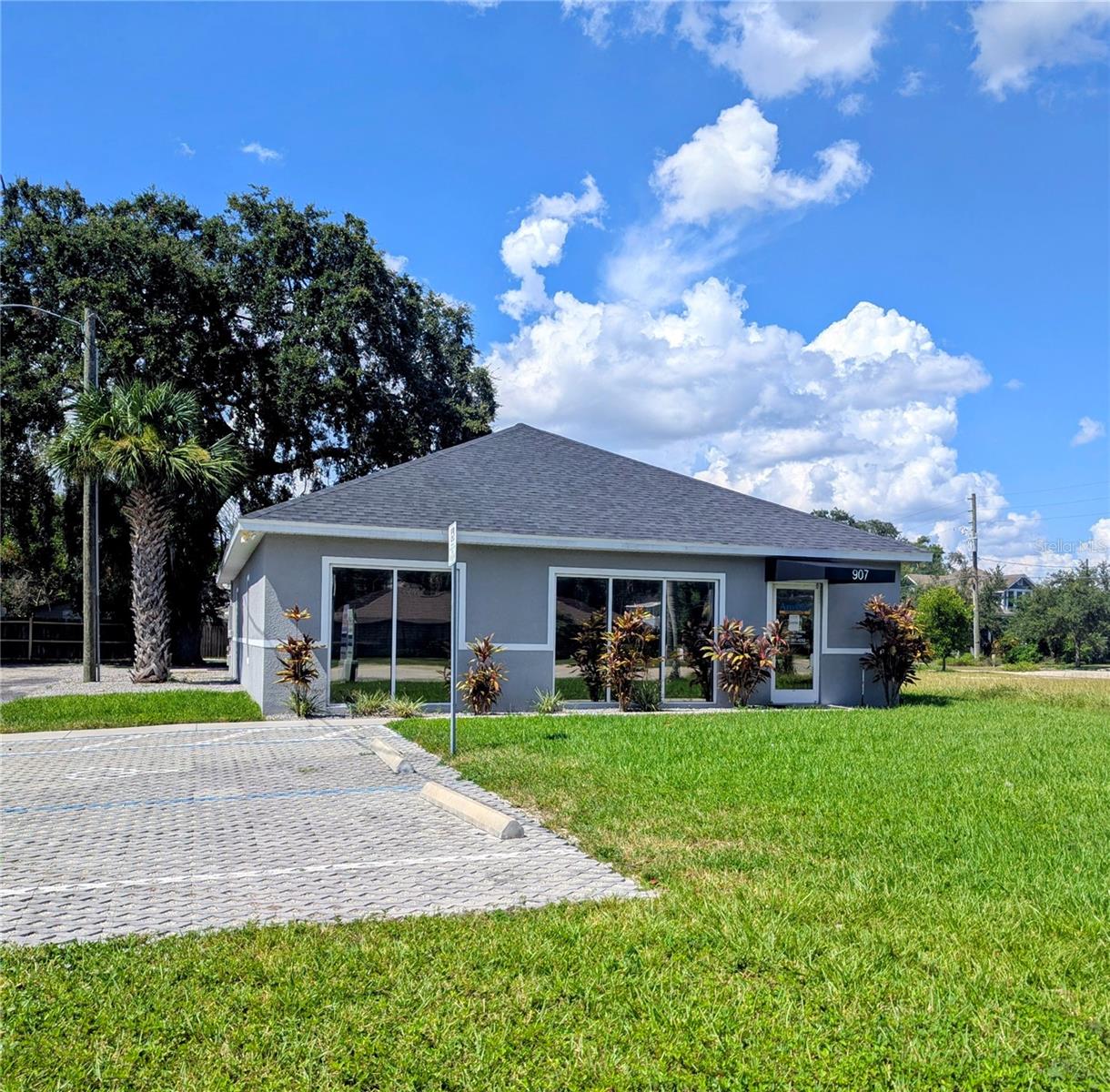 Prime Downtown Kissimmee Commercial Office – 2,035 Sq Ft! Located across from the Kissimmee Courthouse and just steps from vibrant Downtown Kissimmee. This fully renovated commercial office space offers high visibility and excellent access to U.S. 192, John Young Pkwy, and public transportation (SunRail, Lynx, Amtrak). This property is surrounded by a dynamic mix of government offices, restaurants, retail, and scenic lakefront spaces. It features a reception lobby, six spacious offices, a conference room, large eat-in kitchen, two restrooms, and a storage room. Parking with two-way access (via Clyde St & Emmett St), plus signage directly on Emmett Street for daily exposure. Ideal for law firms, title companies, CPAs, and professionals. Move-in ready! COMPLETE A/C INSTALL INCLUDING DUCTWORK, EXHAUST BATH FANS And NEW ROOF (2022)
