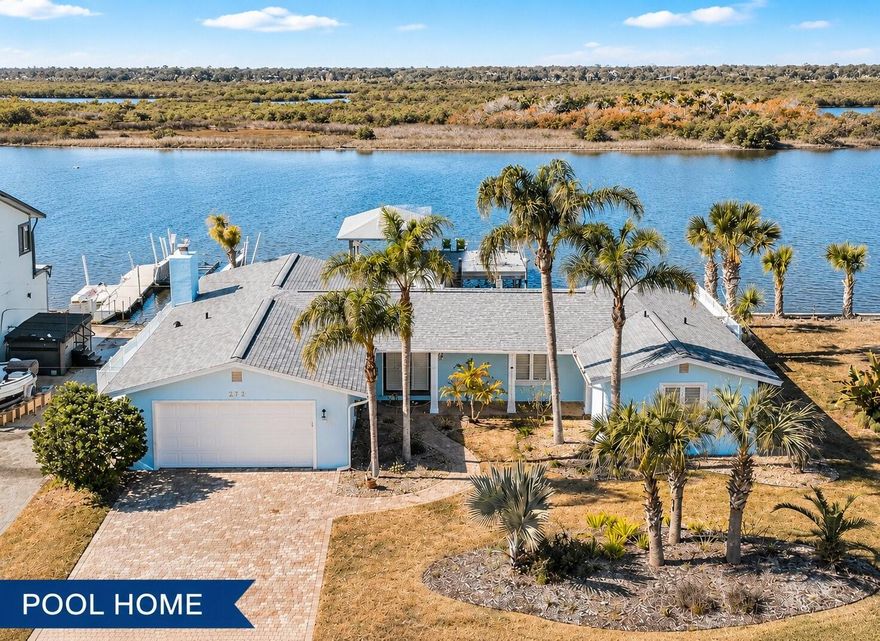 **Partial owner financing available to a qualified buyer.** Turnkey waterfront pool home on the Intracoastal Waterway in Flagler Beach with deep-water boating and beach access just blocks away—now featuring a brand-new roof installed February 2026. This beautifully updated property offers 80 feet of direct Intracoastal frontage on a navigable channel, complete with a 10,000-lb boat lift, making it ideal for serious boaters.

Professionally decorated and fully remodeled in 2017, the home features an open floor plan with luxury vinyl plank flooring, updated baseboards, crown molding, interior doors, and a redesigned living area with recessed lighting. The new roof (February 2026) adds long-term value and peace of mind, complementing the home’s modern upgrades. The spacious primary suite was completely updated, featuring barn doors and a relaxed coastal aesthetic.

This 3-bedroom, 3-bath split floor plan is filled with natural light, enhanced by plantation shutters and expansive windows along the rear of the home that frame stunning Intracoastal views. The kitchen offers granite countertops and a tile backsplash—perfect for entertaining after a day on the water.

Enjoy the best of both worlds—spend the day boating on the Intracoastal and walk just three blocks to the beach for surfing or swimming.

Bonus opportunity: The contiguous waterfront lot next door is available to purchase with the home as a package, or the home may be purchased separately. The additional lot provides 80 feet of frontage, offering a rare chance to own up to 160 feet of Intracoastal water frontage—ideal for building a custom estate or expanding your waterfront lifestyle.

Additional highlights:

New roof installed February 2026

Sells fully furnished (excluding personal items)

Survey available for the home (no survey available for the lot)