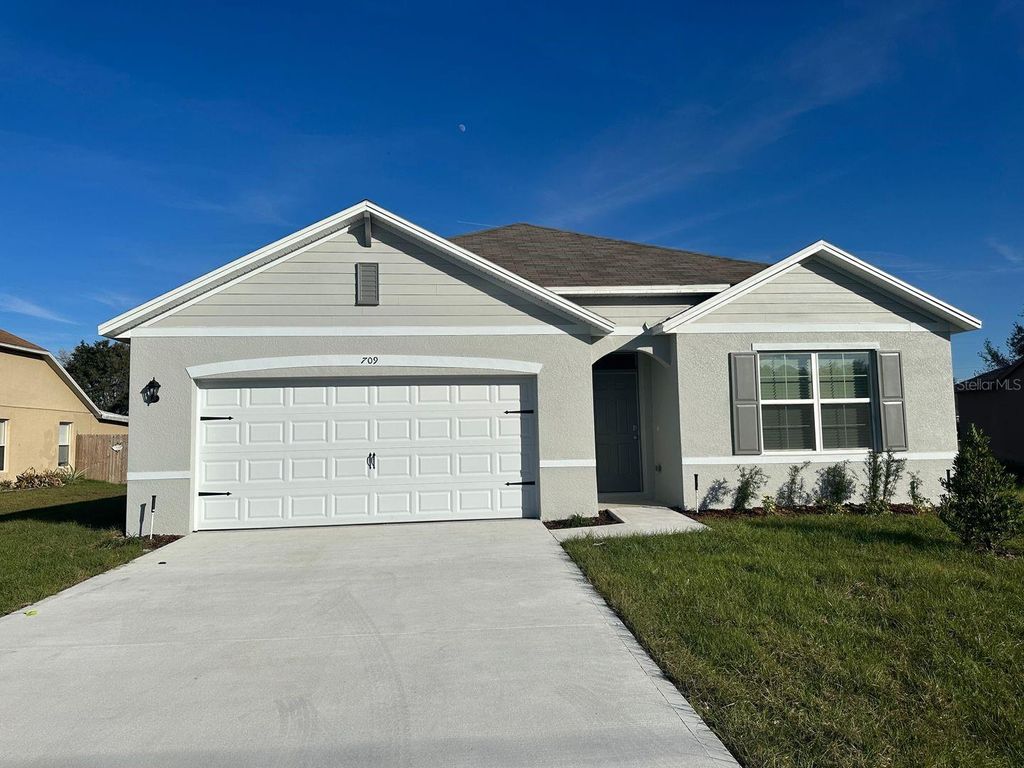 Photo of 709 Versailles Lane, Kissimmee, FL 34759 (MLS # O6409671)
