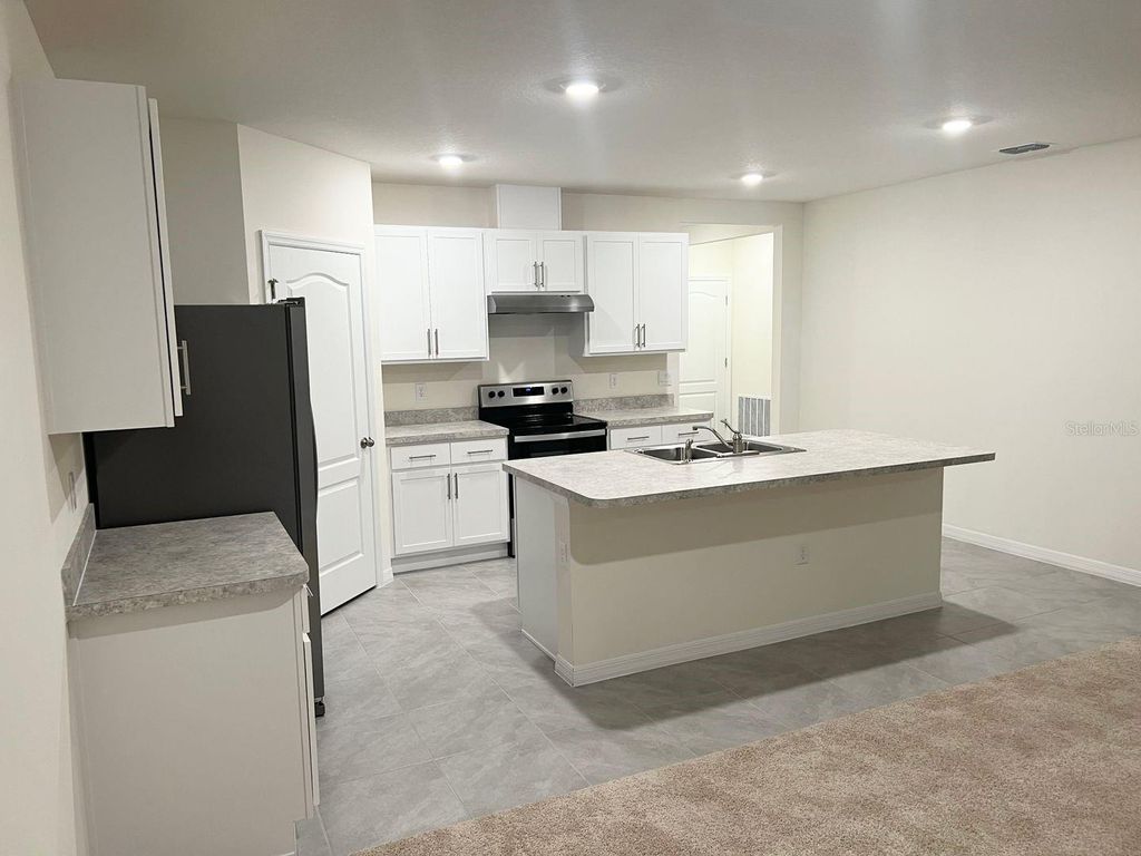 Photo of 709 Versailles Lane, Kissimmee, FL 34759 (MLS # O6409671)
