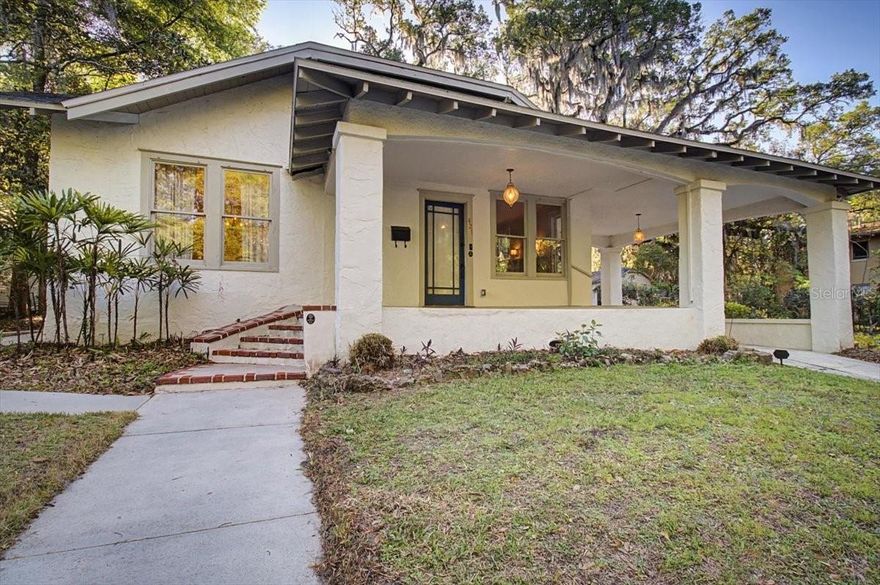 One or more photo(s) has been virtually staged. 1920s Craftsman bungalow on a quarter-acre lot in Duckpond. Shaded by a magnificent live oak and located just steps from the pond and one block from the historic Thomas Center. The property includes the original residence plus a rare additional buildable lot, an uncommon opportunity in Duckpond.

The home retains its classic character with expansive double-hung windows, 9-foot ceilings, original oak hardwood floors, and a formal living room with a gas fireplace. French doors connect the living and dining rooms, creating a bright, inviting central space. The upgraded kitchen features granite countertops, a farmhouse sink, stainless steel appliances, a gas range, and Bosch dishwasher. A recently added second bathroom includes a walk-in shower.

The oversized lot also includes an attached carport, detached garage, and a separate studio structure with plumbing and electrical hookups, ready to finish as an ADU, Airbnb, guest suite, or creative workspace. New roof in 2021.