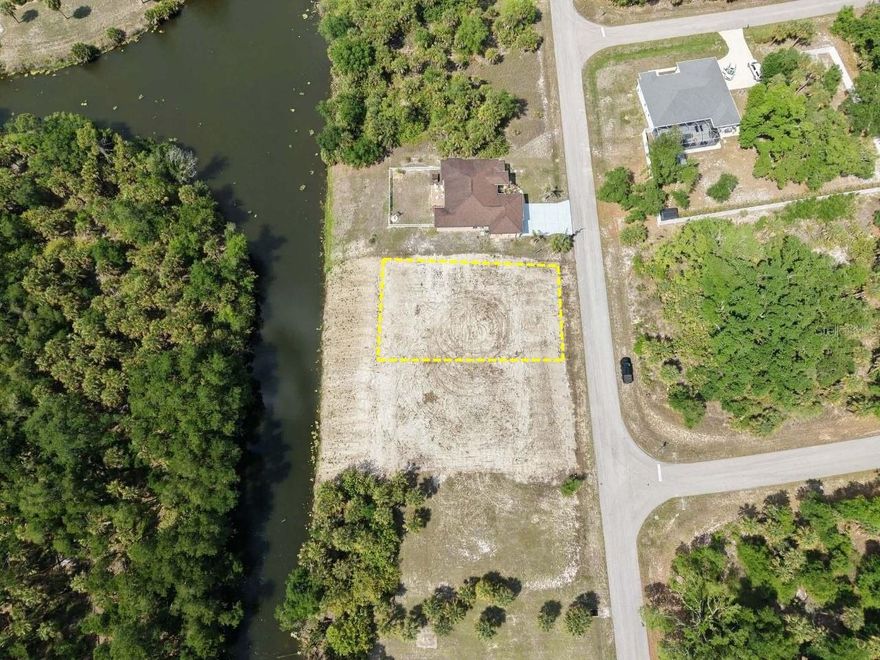 RARE WATERFRONT MULTI-FAMILY OPPORTUNITY – FULLY CLEARED, FILLED, AND BUILD-READY! Experience the pinnacle of investment potential at 553 Pembroke Drive, a stunning waterfront canal lot nestled in a rapidly growing and peaceful neighborhood of Port Charlotte. This premium 10,000 sq ft parcel stands out from the competition as it has been professionally cleared and filled to a high elevation, saving the future owner thousands in site preparation costs and months of development time. Boasting a coveted Vacant Multi-Family (0001) zoning, this property offers incredible versatility—whether you choose to build a high-income producing duplex or a spacious custom waterfront villa. The lot is ideally situated in Flood Zone X, meaning you can enjoy "high and dry" peace of mind without the typical requirement for flood insurance. With 80 feet of canal frontage, you can design an incredible backyard oasis to enjoy the Florida lifestyle. This shovel-ready lot is located in a non-HOA community with no scrub jay permits required (per county maps), offering total freedom for your build. Enjoy convenient and quick access to US-41, I-75, pristine golf courses, world-class fishing, and the vibrant shopping and dining districts of both Port Charlotte and North Port. Utilities are nearby and ready for connection, making this the cleanest and most prepared waterfront lot on the market today. Don’t miss your chance to secure a high-value, ready-to-build property in the heart of Southwest Florida!