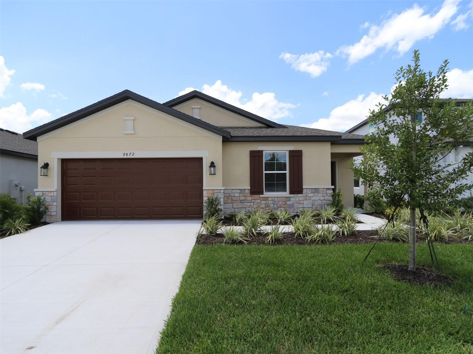 Spacious Lakefront 3-Bedroom + Flex Room Home in Gated Community with Resort-Style Amenities. ****SPECIAL FINANCING AND RATE BUY DOWN OPTIONS AVAILABLE, PLUS $10,000 OFF CLOSING COSTS FOR A LIMITED TIME ONLY FROM PREFERRED LENDER. RESTRICTIONS APPLY, FOR QUALIFIED BUYERS, SUBJECT TO APPLICABLE TERMS AND CONDITIONS. SUBJECT TO CHANGE WITHOUT NOTICE**** The Camelia floor plan is a beautifully designed single-story lakefront home offering 2,112 square feet of stylish, open concept living. Just minutes from major highways, shopping, dining, and top-rated schools. Inside, a bright and inviting foyer leads to a private flex space—ideal for a home office, gym, or guest suite with a nearby full bath. Two secondary bedrooms share a full bathroom in a separate wing, offering privacy for family or guests. The heart of the home is the open kitchen, dining, and great room, with tile plank flooring, perfect for entertaining and everyday living. The kitchen features quartz countertops, an oversized island, stainless steel appliances, and ample cabinetry. Large windows fill the great room with natural light and serene views of the covered lanai and backyard with peaceful lake views. The owner’s suite is tucked away in its own private wing and features a spa-like en-suite bathroom with a huge walk-in shower and a generous walk-in closet. Additional highlights include a large laundry/utility room with garage access. Live your best life in this modern, energy-efficient home located in Summerwoods, master-planned community offering resort-style amenities including a swimming pool, playground, walking trails, and more.