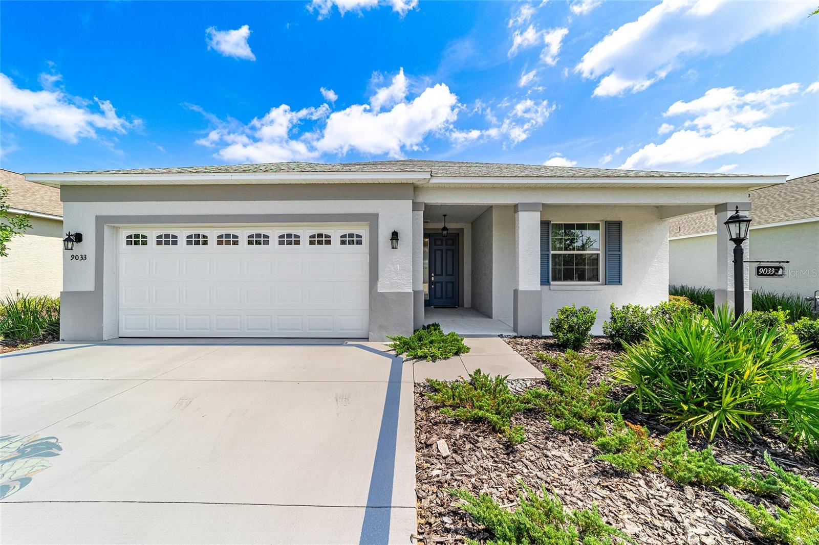 Welcome to this beautifully upgraded Sunflower model in the sought-after Weybourne Landing community. Featuring 3 bedrooms, 2 bathrooms, and a 2-car garage with a 4-foot extension, this home offers over $45,000 in builder upgrades and is situated on a premium privacy lot. The open layout showcases tile flooring throughout, tray ceilings in both the living room and primary suite, and a gourmet kitchen with bullnose quartz counters, designer backsplash, stainless steel appliances, and a gas range with dual oven and griddle. The primary suite includes a spacious walk-in closet with direct laundry access for convenience. Outdoor living shines with a screened lanai, solar shades, paver patio, and a grill with a dedicated gas line for grilling. Additional features include a whole-house surge protector, salt-free water softener, pre-wiring for a generator, and smart home technology with Ecobee, Ring, and Alexa devices. Enjoy resort-style community amenities such as a pool, pickleball courts, dog park, and mini golf in one of the area’s most desirable active adult neighborhoods.