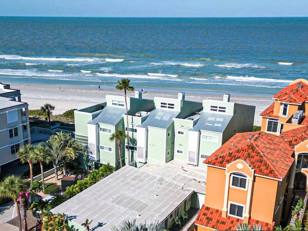 Welcome to Sun Place Unit 1A, a vibrant and newly remodeled, with permits, Jan 2025, ground-floor 1-bedroom, 1-bathroom beachside retreat just steps from the beach in highly desirable Indian Shores. Whether you're looking for a personal getaway, an investment property, or both—this guest favorite turnkey condo delivers with short-term rental potential and pet-friendly policies. Step inside to a bright, coastal-inspired living space with crisp white shiplap ceilings, warm wood-look tile floors, and playful tropical décor. The spacious living area features a comfy sectional, colorful accents, and large front-facing windows for natural light. The fully remodeled kitchenette boasts white shaker cabinets, butcher block counters, modern hardware, stainless appliances, and a charming hex-tile backsplash in beachy blues. The private bedroom is equally inviting with tasteful beach-themed decor, a mounted flat-screen TV, and direct access to a stylish en-suite bathroom featuring a walk-in glass shower, round mirror, and designer lighting. Outside, enjoy a private patio for dining or relaxing al fresco, and walk straight out to the sun deck and sugar-white sands of the Gulf. There is a walkway out the back door that leads to the laundry room with free washer and dryer for you or your guests to use and the walkway continues out to the beach. One assigned parking space included as well a being conveniently located near dining, shops, parks, and the beach trolley stop. This coastal retreat checks all the boxes for a smart investment or relaxing getaway. Condo fee includes cable, internet/wifi, exterior pest control, this helps save on monthly expenses.
Whether you're sunbathing on the beach, strolling to nearby cafes and shops, or welcoming vacationing guests, Sun Place 1A offers the perfect blend of beach lifestyle and income potential in one of Florida’s most charming coastal towns. Don't miss this rare opportunity to own a slice of paradise on Indian Shores. This special bungalow is a must see!