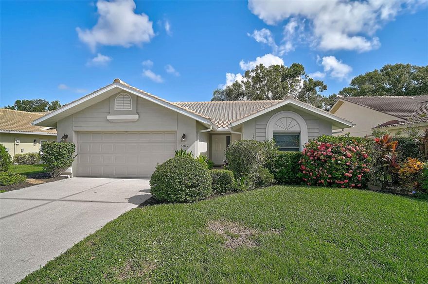 One or more photo(s) has been virtually staged. Discover the perfect blend of comfort, style, and waterfront tranquility in this beautifully maintained 3 bedroom, 2 bath home in the highly sought after Longwood Run community. Designed with a desirable split bedroom floor plan, this home offers both privacy and versatility. The second bedroom and a full bath are conveniently located near the entry, while the third bedroom with sliding doors can easily serve as a guest room, home office, or playroom.

The renovated kitchen is a chef’s delight, featuring sleek stainless steel appliances, abundant cabinetry, elegant quartz countertops, and a cozy breakfast nook. Adjacent to the kitchen, the laundry room leads directly to the spacious two car garage for added convenience. The bathrooms have been tastefully updated, and the home has been freshly repainted, creating a crisp, move in ready feel.

Throughout the home, stylish wood look tile flooring complements the vaulted ceilings, beautifully enhanced with crown molding. The expansive great room seamlessly connects to the dining area, creating an inviting space for both relaxation and entertaining. Triple sliding glass doors open to an oversized screened lanai, where breathtaking pond views and a lush backyard provide a peaceful retreat.

The private primary suite, located at the back of the home, offers vaulted ceilings, two generous walk in closets, an en suite bath, and direct access to the lanai, allowing you to wake up to serene water views every day. A barrel tile roof was replaced in 2014. The home’s prime location is less than three miles west of I 75 with easy access to University Town Center Mall, Publix, CVS, and Walgreens. World famous St. Armands Circle and the stunning Gulf Coast beaches are just a short drive away.

Don’t miss the opportunity to own this exquisite waterfront home in one of the area’s most desirable communities.