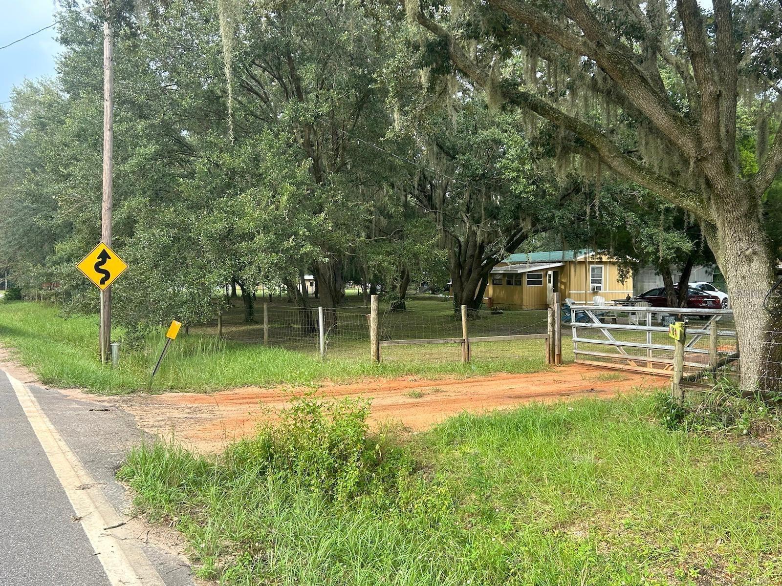 Excellent property consists of a mobile home, additional Shed, Cabana, Barn Storage, garage for two cars, has 3 wells because at one time it was planted with oranges.