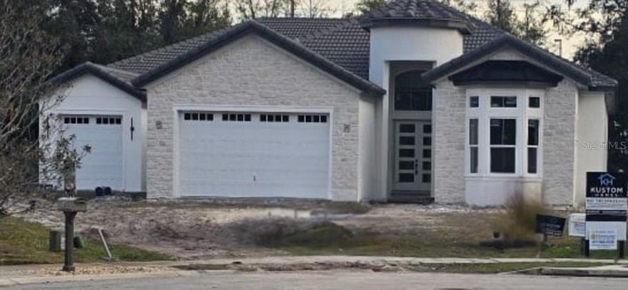 Under Construction. Welcome to 101 Hallmark Ct., Lake Mary, FL 32746, a stunning new construction home that seamlessly blends modern elegance with thoughtful design. Situated in a quiet cul-de-sac, this expansive 5,699 sq. ft. under-roof masterpiece features a luxurious four-bedroom, three-and-a-half-bathroom layout with premium finishes, high-end craftsmanship, and an oversized three-car garage. Currently under construction and nearing completion, this is a rare opportunity to own a brand-new, custom-built home in one of Lake Mary’s most sought-after neighborhoods.  

The home’s Mediterranean-inspired architecture creates an impressive first impression with its stone-accented façade, barrel tile roof, and an elegant glass-paneled entryway. A paver driveway leads to dual garages, providing ample space for vehicles, storage, and recreational equipment. Inside, soaring ceilings and expansive living spaces set the stage for both grand entertaining and comfortable everyday living.  

The heart of the home is a gourmet kitchen designed for culinary excellence, featuring top-of-the-line appliances, a gas cooktop, an oversized island, custom cabinetry, and a spacious walk-in pantry. The great room boasts 14-foot ceilings and oversized windows that flood the space with natural light while offering a seamless flow to the covered lanai. Adjacent to the kitchen, both formal and casual dining areas provide options for intimate dinners or larger gatherings.  

The private owner’s suite serves as a serene retreat, complete with a spa-like en-suite bath featuring a freestanding soaking tub, glass-enclosed shower, and dual walk-in closets. The additional three bedrooms are generously sized, including a guest suite with a private bath. A dedicated office and club room provide versatile spaces ideal for working from home or creating a personal media or game room. Thoughtfully designed for convenience and organization, the home also includes a spacious laundry room and a mudroom.  

Designed to embrace Florida’s outdoor lifestyle, this home features a covered lanai and a spacious backyard, providing the perfect setting for a future custom pool and spa as detailed in the blueprints. Lush landscaping enhances the property’s privacy while maintaining a close connection to all that Lake Mary has just for you.  

Located in one of Central Florida’s premier communities, this home is just minutes from top-rated Seminole County schools, the upscale shops and fine dining at Colonial Town Park, and the exclusive amenities of Heathrow Country Club. Outdoor enthusiasts will love the nearby Seminole Wekiva Trail, perfect for biking and jogging, while commuters will appreciate the easy access to Interstate 4 and the 417 Expressway, connecting them to Orlando, the beaches, and beyond. For medical needs, AdventHealth Lake Mary provides state-of-the-art healthcare facilities just minutes away.  

This exceptional home combines high-end design with an unbeatable location, offering a lifestyle of luxury and convenience. Don’t miss your chance to make this brand-new custom residence your own. Schedule a private consultation today to learn more about customization options and estimated completion dates before this rare opportunity is gone.