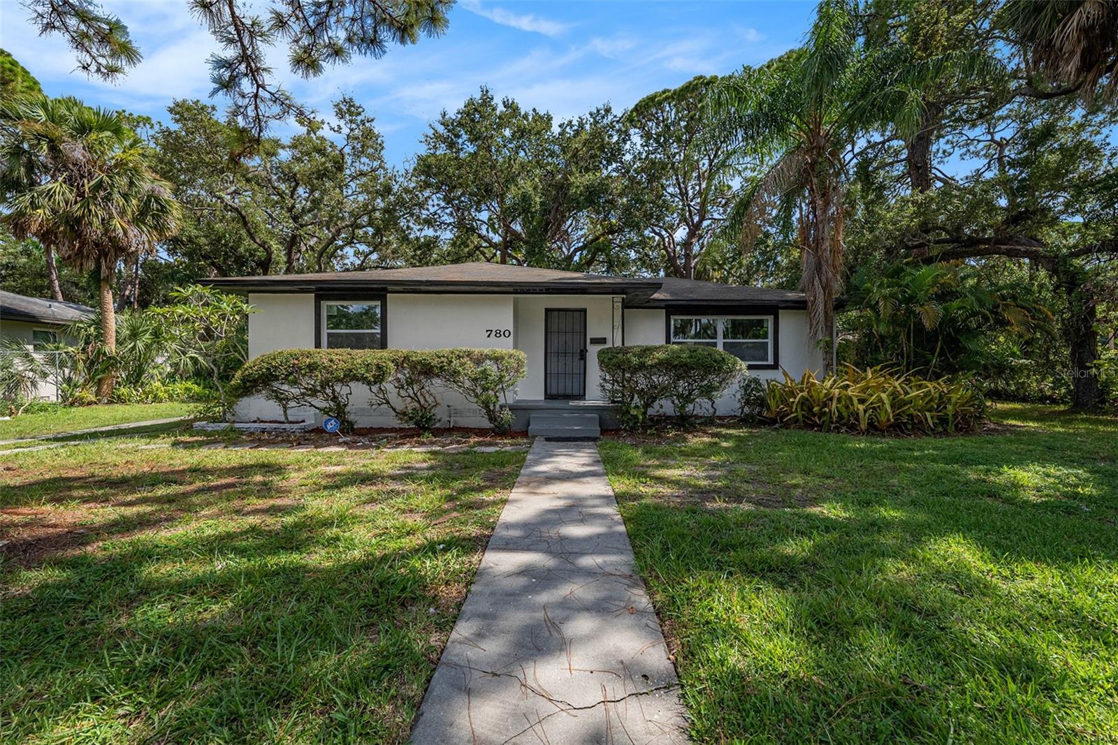 The perfect family home awaits! This spacious 3 bedroom, 2 full bathroom, 2 car garage, with Oversized lot is ready for you to move right in , located only 10 minutes from St Pete Downtown COULD VERY WELL BE A POTENTIAL VACATION HOME OR AIRBNB HOME, As you enter the home you will notice a large open floor plan, great for entertaining. Dining room and kitchen combo, Features Include New A/C System 2021. Stunning updated eat in kitchen w/ QUARTZ COUNTERTOPS, Breakfast Bar, all New Stainless Steel Appliances, Totally remodeled in 2025 recessed lighting and Ceiling Fan in every single room, Brand New windows throw-out the home , NEW ELECTRICAL PANEL, and full house RE-WIRE, New fresh paint interior and exterior, The primary bedroom features an updated Bathroom with Quartz Countertops and new vanity and walking shower, natural light fills every room through the new impact windows, which not only enhance the energy efficiency of the property but also add a touch of elegance. This home sit in almost half of acre lot with 420 sqft detached garage with plumbing and electric ready, plenty space for a man cave or future mother in law suite, spacious driveway allowing plenty of room for boat or extra cars storage, You can sit and enjoy the peace and beauty of the surroundings. Located in a non-HOA community, you'll appreciate its close proximity to to Downtown, the Pier under 10 minutes and top beaches in florida, as Pass-a-away Grill Beach only 17 minutes This is a must-see, well-kept, and maintained home.