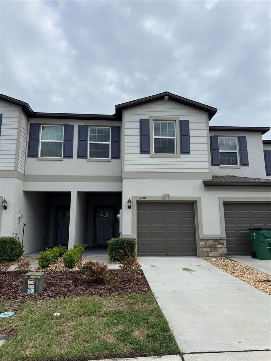 Immaculate, like-new townhouse featuring 3 bedrooms and 2.5 baths with a bright, open floor plan. The first floor offers elegant tile flooring, while the stairs and second level are finished with soft carpeting. The kitchen includes granite countertops, stainless steel appliances, and ample cabinet space. Crown moulding enhances both the first and second floors, and ceiling fans are installed throughout. This well-maintained home also includes a one-car garage.
Located in a beautifully kept community with plenty of guest parking, residents enjoy access to a stunning clubhouse ideal for gatherings and special occasions. The clubhouse area features a spacious outdoor barbecue space overlooking the pool and playground. The community gym is well equipped, offering convenience and comfort close to home.  The community also offers beautiful winding walking paths and peaceful sitting areas, including a charming gazebo that welcomes you as you enter the neighborhood.