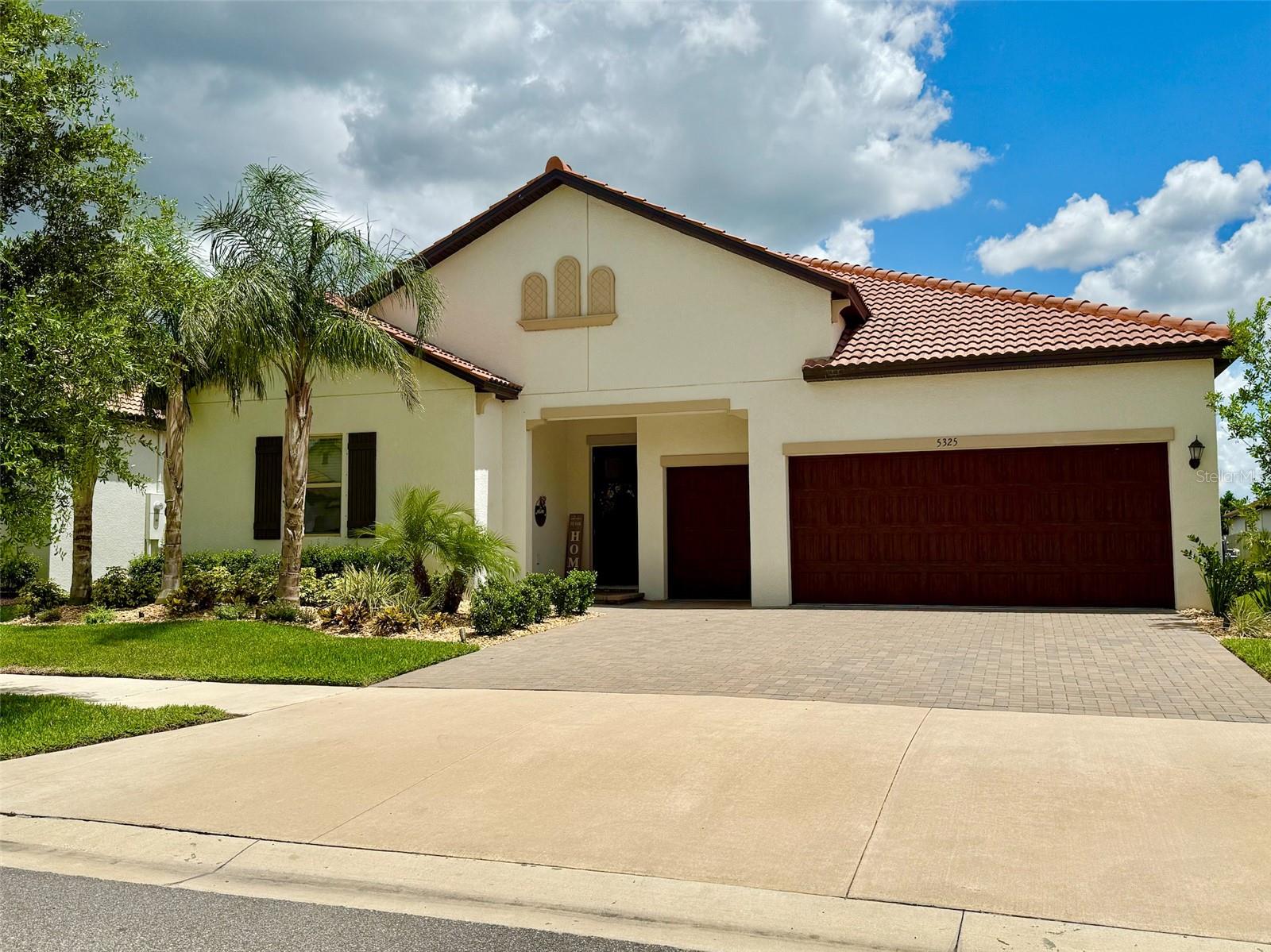 Welcome to 5325 Kelper Hook Ct., an extensively upgraded home in the highly sought-after Medley at Southshore Bay, a premier 55+ gated community with resort-style amenities. Perfectly positioned on a quiet, low-traffic street, this residence offers 3 bedrooms, a spacious flex room, 2.5 baths, and 2,363 sq ft of living space, plus a golf cart garage with upper storage.
From the moment you enter, you’ll notice the upscale finishes—tray ceilings with crown molding, luxury ceramic plank tile flooring throughout, and an open-concept floor plan designed for both comfort and style. The interior features designer ceiling fans and lighting, enhancing every room’s appeal. The gourmet kitchen is a showstopper with quartz countertops, a built-in GE oven/microwave, gas cooktop, upgraded dishwasher, butler’s pantry, custom walk-in pantry, and a custom wine bar with built-in cabinetry.
The spa-style primary suite showcases elegant tile flooring throughout—including in the spacious walk-in closet with built-ins—and a primary bath with dual quartz vanities, an oversized walk-in shower, custom blinds, and deep drawers for extra storage.
Triple sliding glass doors open to a screened lanai with tile flooring, custom lanai shades, and remote-controlled ceiling fans. The fully fenced backyard is a beautifully landscaped oasis with extended paver patio, landscape stone accents, and LED landscape lighting—perfect for relaxing or entertaining.
Community amenities include a 5-acre crystal lagoon with kayaking and paddleboarding, a private 55+ heated resort pool with bar and dining service, clubhouse with ballroom and game rooms, state-of-the-art fitness center, pickleball courts, walking/biking trails, dog park, and year-round social events.
This is more than a home—it’s a lifestyle! Schedule your private showing today.