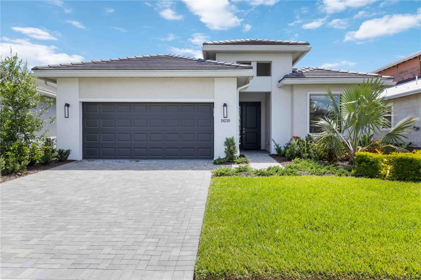 Immaculate and upgraded 3-bedroom, 3-bath home in Cresswind at Lakewood Ranch, a top 55+ gated community. This residence features custom tile flooring throughout, luxurious floor-to-ceiling tiled bathrooms, beautiful light fixtures, and custom motorized window treatments for modern ease. The kitchen offers an extra dining nook and opens to the spacious living area — ideal for entertaining.
Enjoy Florida living with a fully equipped outdoor kitchen, wet sink, extended lanai, and paver patio, perfect for gatherings or relaxing evenings under the stars.
All of this is located in the heart of Lakewood Ranch—close to parks, shopping, dining, and an award-winning Farmers Market! This location can't be beat! Plus, on any given Tuesday night, you can catch a sunset on any number of world-famous beaches! This is one you can't miss! Reach out to Noelle to schedule a showing.