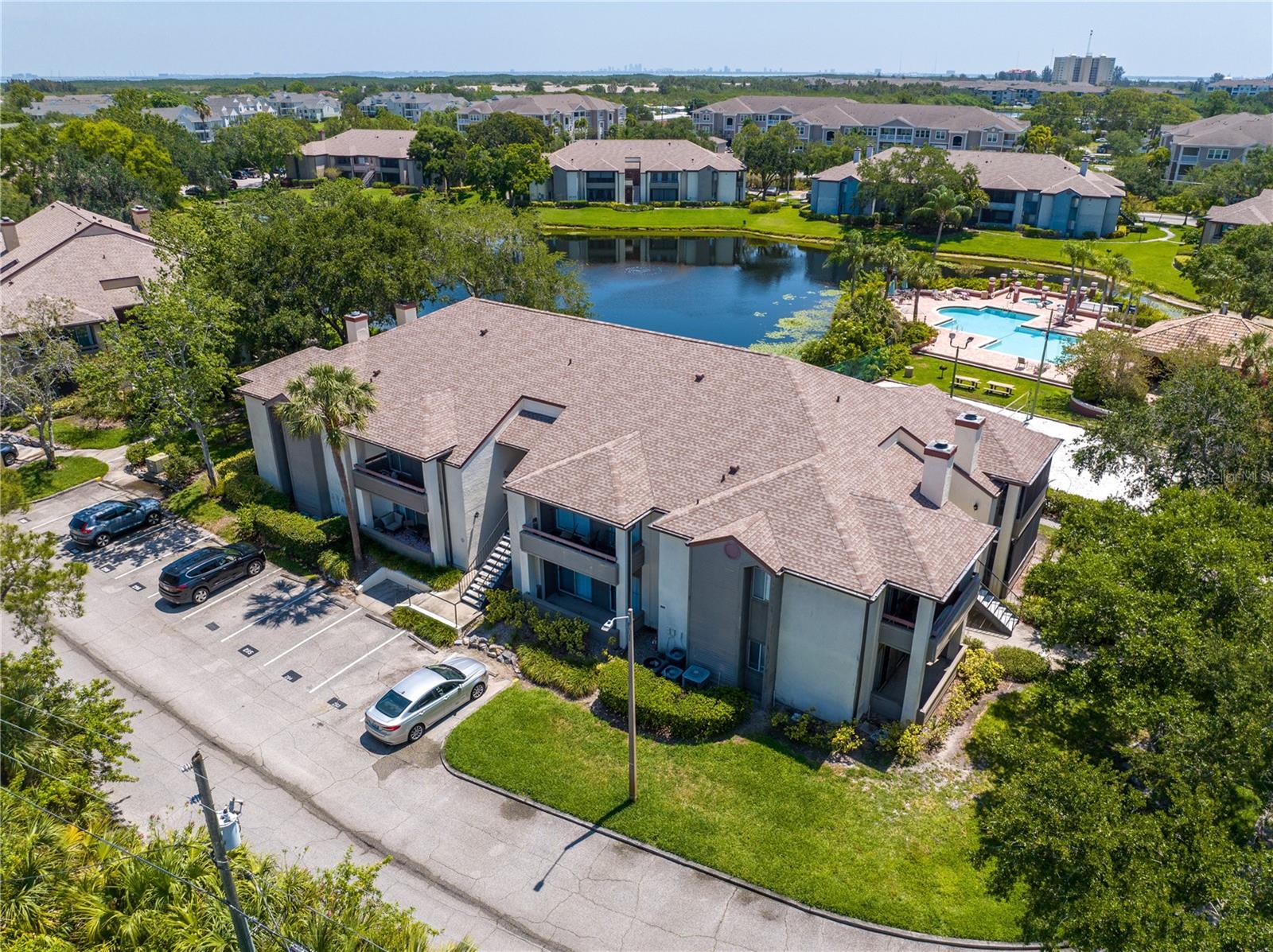 Step into the highly sought-after gated paradise known as "Itopia." This immaculate, ground-floor condo offers 1 bedroom, 1 bathroom, and a spacious great room. But that's not all! This fully modernized gem boasts an inviting open floor plan, a convenient storage closet on the balcony, a roomy walk-in closet, a full-size washer and dryer, and a gorgeously renovated kitchen with quartz countertop. Itopia Condominiums redefines the art of resort-style living, providing you with access to not one, but two heated swimming pools and bubbling hot tubs. Keep your fitness goals on track at the well-equipped fitness center, or unleash your competitive spirit on the sand volleyball court. You can also unwind in the indoor sauna, perfect your tennis game, shoot some hoops on the basketball court, or pamper your car at the convenient wash station. Pet lovers, rejoice! There's even a dog park where your furry friends can frolic freely. Need to catch up on work or simply surf the web? The business center with Wi-Fi is at your service. And when it's time to host gatherings or celebrations, the clubhouse with a fully-equipped kitchen has you covered. Location-wise, Itopia puts you at the center of it all. Conveniently situated near I-275, the bustling 4th Street corridor, Tampa International Airport, and MacDill AFB, you're just minutes away from the sun-soaked shores of St. Pete Beach and the vibrant downtown scene. Don't wait! Step into your dream lifestyle today at Itopia – where every day feels like a vacation.