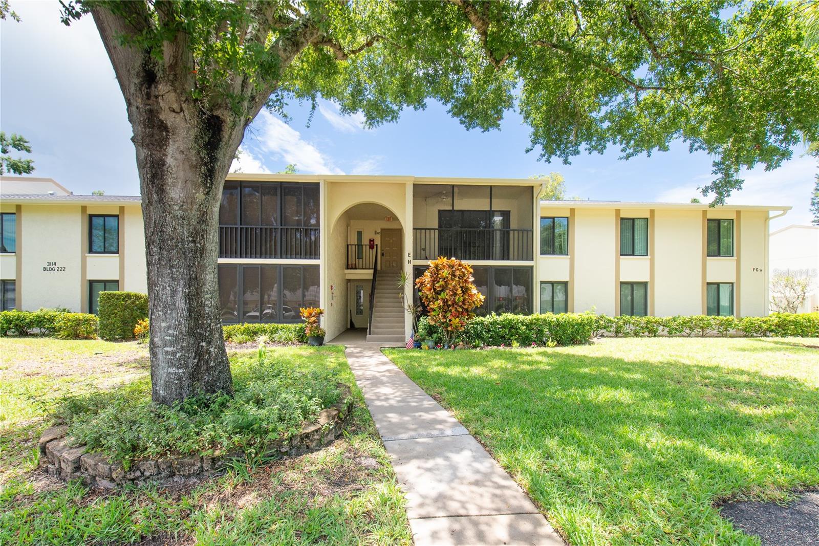 We are ready to sell! Affordable & Move-In Ready 3BR/2BA Condo in a desirable Deer Hollow at Lake Tarpon Village! Welcome to this charming and spacious 3-bedroom, 2-bathroom second-floor condo offering 1,395 sq ft of living space (1,465 sq ft total) in the highly sought-after community of Pine Ridge at Lake Tarpon Village. This updated, move-in ready home features a large private balcony, a generous laundry room, and abundant storage throughout. Enjoy modern upgrades including durable vinyl flooring, stylish new light fixtures, sleek door handles, and freshly painted interiors. Both bathrooms feature updated vanities, adding a contemporary touch to your daily routine. A newer roof (2021), updated windows (2019), and a brand-new microwave and (2025) dishwaser plus, the rest of the appliances are just a few years old! The resort-style community offers amenities galore: heated pool, jacuzzi, tennis courts, playground, clubhouse perfect for hosting large gatherings, and beautifully maintained mature landscaping. It's a pet-friendly neighborhood with an active yet peaceful atmosphere. Located in an excellent school district: Cypress Wood Elementary, Tarpon Springs Middle, and East Lake High. Enjoy assigned parking and ample guest parking right in front of the building. Close to parks, shopping, and more! HOA dues are $2,107 quarterly ($702.47/month) and include water, sewer, trash removal, exterior maintenance, management, roof and other reserves, and access to all community amenities. Owners must hold for 2 years before renting. This home offers carefree Florida living at its best—schedule your showing today and make it yours!