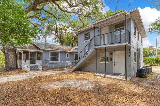 Attention investors! **PRICE IMPROVEMENT BELOW APPRAISED VALUE** A rare opportunity to own an updated duplex in the heart of Downtown Orlando’s booming sports and entertainment district. Located at 1025 Colyer Street, this income-producing property features two spacious 2-bedroom, 1-bathroom units, both offering comfortable living spaces with functional layouts. With no HOA and a newer roof and HVAC system, this duplex provides low-maintenance ownership and a prime location for steady rental demand. Inside, each unit features dedicated living and dining areas, ample natural light, and functional kitchens with cabinet and counter space. The shared driveway easement provides parking access, adding convenience for tenants. The fenced lot offers additional privacy and security, making this property an attractive option for renters looking for a home near all that Downtown Orlando has for you. Situated directly behind the new Orlando Police Headquarters, this property is within minutes of major attractions, including Camping World Stadium, which hosts concerts, football games, and large-scale events, Exploria Stadium, home to Orlando City Soccer Club, and Kia Center, formerly known as Amway Center, a hub for NBA games, concerts, and entertainment. Just a short drive away, you’ll find Creative Village and the UCF Downtown Campus, a rapidly expanding educational and tech hub, as well as Lake Eola Park and Thornton Park, where residents can enjoy scenic walking trails, paddle boating, outdoor events, and a vibrant nightlife scene.
With easy access to I-4 and SR 408, this property is perfectly positioned for commuters and professionals working in Downtown Orlando and surrounding areas, 25-30 minutes to Disney and 18-20 min to Sea World and Universal Studios. The thriving rental market, coupled with the property’s central location, makes it an excellent addition to any investor’s portfolio. Nearby shopping and dining options abound, with restaurants such as Russell’s on Lake Ivanhoe, Santiago’s Bodega, and The Wellborn offering a variety of upscale and casual dining experiences. For everyday essentials and retail therapy, residents have access to Orlando Fashion Square, The Mall at Millenia, and other shopping centers. For medical and emergency services, major hospitals including Orlando Health and AdventHealth Orlando are just a short drive away, offering world-class healthcare and peace of mind for residents. The downtown market continues to see strong rental demand, making this duplex an attractive option for both first-time and seasoned investors.
With the additional potential to purchase the adjacent single-family home at 1029 Colyer Street, this property can also be sold individually or together offering the potential to own three income-generating units side by side in an area experiencing continuous growth and redevelopment. Whether you are looking to expand your investment portfolio or secure a high-demand rental property in a sought-after location, this duplex offers exceptional value and strong return potential. Don’t miss out! All descriptions and measurements are from appraisal and to be verified.