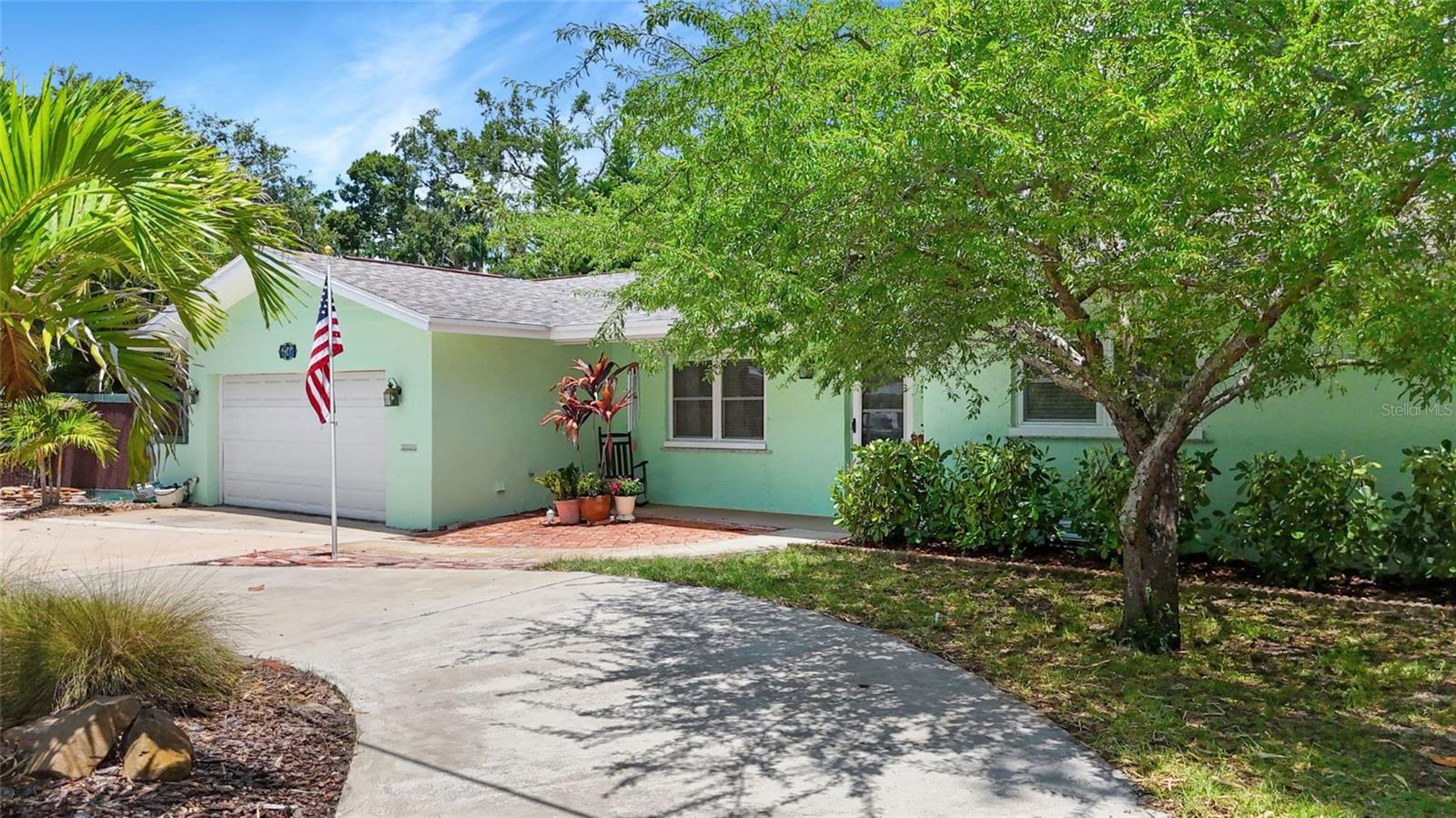 Stunning 4 bedroom, 3 bathroom home ideally located on a large, lushly landscaped corner lot in the desirable Stetson area of Gulfport. Perfectly positioned between downtown Gulfport and South Pasadena, this beautifully maintained home offers exceptional flexibility and comfort. The house features 4 spacious bedrooms, two of which are primary bedrooms with their own ensuite bathrooms, plus an additional guest bathroom. With an open-concept floor plan that flows effortlessly from the entryway through the dining room, living room, media room, and into the fully renovated modern kitchen. Updated in 2021, the masterfully created kitchen includes a designer pantry system, gas range, soapstone island, quartz countertops, new appliances, and a state-of-the-art 3-tier water filtration system. The kitchen opens onto a screened-in Lanai, which leads to an enclosed fiberglass, natural gas-heated pool. Creating a seamless indoor/outdoor living and entertaining space to support that Florida lifestyle you have been dreaming about. The pool's heating and filtration systems have been fully updated within the past two years, ensuring worry-free enjoyment. The large, extra roomy primary suite boasts its own bathroom, kitchenette, laundry room, and private deck—providing you with your own private retreat or giving the perfect opportunity for guests, extended family, or potential rental income. Additional amenities include a two-car garage with ample storage, a circular driveway, and a versatile, air-conditioned cabana that would make an ideal office, studio, or lounge space. This solid block home is not located in a flood zone and includes hurricane-impact windows and doors with removable hurricane shutters for added security. An in-ground irrigation system, which runs on pump and well water, will keep the beautifully landscaped yard thriving year-round. Major updates include a new roof in 2015, hardwood flooring in 2021, pool and enclosure added in 2016, and a new PVC sewer line in 2024. With spacious living areas, modern updates, and seamless indoor-outdoor flow, this home is perfect for entertaining and offers the rare opportunity for both luxury living and additional income in one of Gulfport’s most sought-after neighborhoods. This rare Gulfport gem will not be on the market long so, schedule your private showing today!