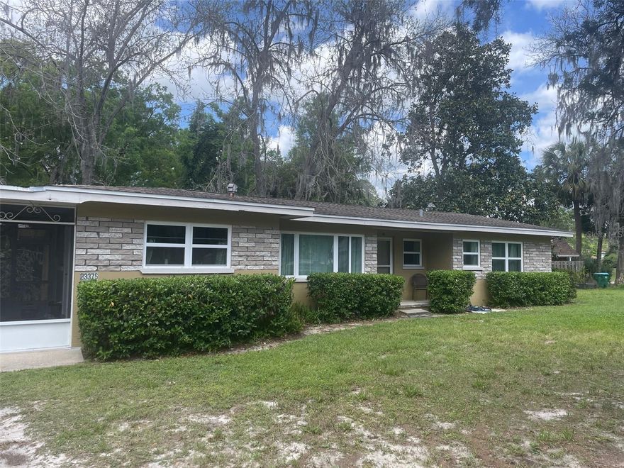 Short Sale. **Bank approved price for short sale!!!* Check out this home and possibly buy it with NO money down! 3/2 concrete block home in beautiful High Springs, Florida! This home is steps away from downtown High Springs and a short drive to all of the nature, river and springs! And you have a public park with a playground, fields to play on and a frisbee golf course right in your backyard! Inside the home, the updates are a plenty! A NEW HVAC, refinished REAL wood flooring, newer windows, freshly painted throughout the interior and new kitchen appliances. This home has 3 oversized bedrooms with 2 bathrooms, and whether you work from home or want that mancave, the bonus room would be a perfect office/den won't disappoint! Screened side porch that steps out onto a spacious patio overlooking the large backyard, great for your morning coffee or enjoying the cool weather we're having! Just 10 minutes from nearby Alachua with access to I-75, making the commute to Gainesville for work, school and entertainment convenient for you. Call today for more information and schedule a private tour!