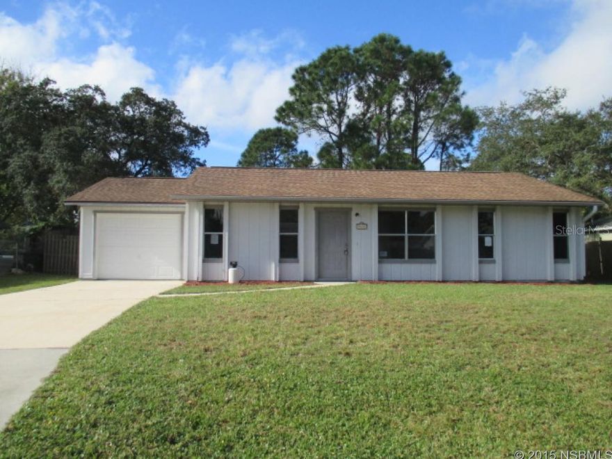 REDUCED!!!  Located in the heart of Edgewater's, Florida Shores. This spacious 3 bedroom, 2 bath, 1 car attached garage features a large open living room, eat-in kitchen that has Sliding doors leading to the large, fenced back yard and patio. Inside laundry room. A little elbow grease and this home will shine. Just minutes to Shops, Dining, Schools and I-95. This is a Fannie Mae Homepath property. All information recorded in the MLS is intended to be accurate but cannot be guaranteed, buyer advised to verify. ;Water: City