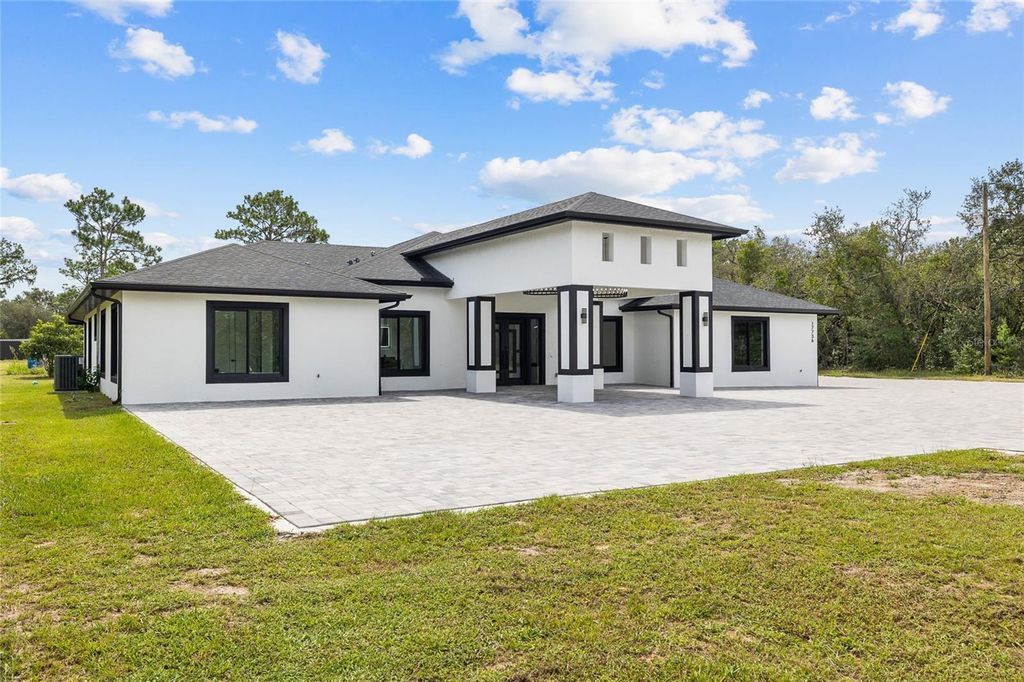 Photo of 17736 Overstreet Lane, Spring Hill, FL 34610 (MLS # TB8416221)