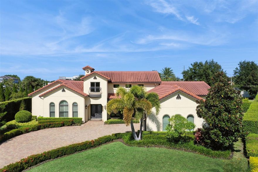 STUNNING CUSTOM ESTATE in the EXCLUSIVE GATED community of Sawyer Sound - a private enclave of 20 luxury homes, ideally located across the street from Windermere Prep, and close to excellent dining and premiere entertainment. Built under the meticulous supervision of its owners, one of whom is an accomplished interior designer, this home showcases curated exceptional quality finishes and craftsmanship, and attention to detail. With natural MARBLE FLOORS, soaring ceilings adorned with real WOOD BEAMS, solid-core interior doors, designer lighting, thick crown moulding, beautiful CUSTOM window treatments and appealing color schemes, you'll find LUXURY in every detail. The chef's kitchen is a masterpiece with rare natural stone CRISTALLO QUARTZITE counters featuring under lighting for a warm dramatic glow, custom wood cabinets, a COPPER farmhouse sink, imported fixtures, and all THERMADOR appliances - including an 8 burner NATURAL GAS range and a built in STEAM OVEN that functions as microwave, convection oven, and air fryer. Gatherings in this home are show stoppers with STACKED SLIDING DOORS that disappear to create a seamless transition to the lanai, pool area with gorgeous NATURAL TRAVERTINE, REMOTE CONTROLLED RETRACTABLE SCREENS, NATURAL GAS FIREPLACE, SUMMER KITCHEN, SALT WATER HEATED POOL,  and a LUSHLY LANDSCAPED backyard oasis with a tiki hut - LIVE EVERY DAY LIKE A VACATION! Enjoy the comfort of TWO PRIMARY SUITES, each with spa style luxury bathrooms offering large showers, soaking tubs and custom walk-in closets. The main suite has a bedroom in close proximity that would be an ideal nursery, library or office. Two more bedrooms share a beautifully designed bathroom and each has a walk-in custom closet. Rooms are adorned with real wood PLANTATION SHUTTERS and/or DESIGNER MADE WINDOW TREATMENTS, including silk lined drapes with darkening fabric in the primary suite. Practical luxury continues with a huge laundry room with granite counters, custom cabinets, closet, sink and a folding area. The pantry doubles as a thick concrete reinforced “SAFE ROOM" equipped with a phone line and additional security and safety features. ENTIRE HOME NATURAL GAS GENERATOR ensures no interruption to your comfort. Every detail has been thoughtfully considered - from the water softener, energy efficient foam insulation, and double paned windows to the climate controlled three car garage with an EV car charger, epoxy floor, custom storage, large safe, and bike racks. SMART HOME technology allows you to control all systems from your phone - the thermostat, pool, lighting, interior and exterior cameras, and music. COME SEE WHAT SETS THIS MASTERPIECE APART FROM THE REST! EVERY SPACE IN THIS HOMe TELLS A STORY OF LUXURY, DESIGN AND COMFORT - CRAFTED FOR THOSE WHO EXPECT THE BEST! All measurements should be verified by buyer.