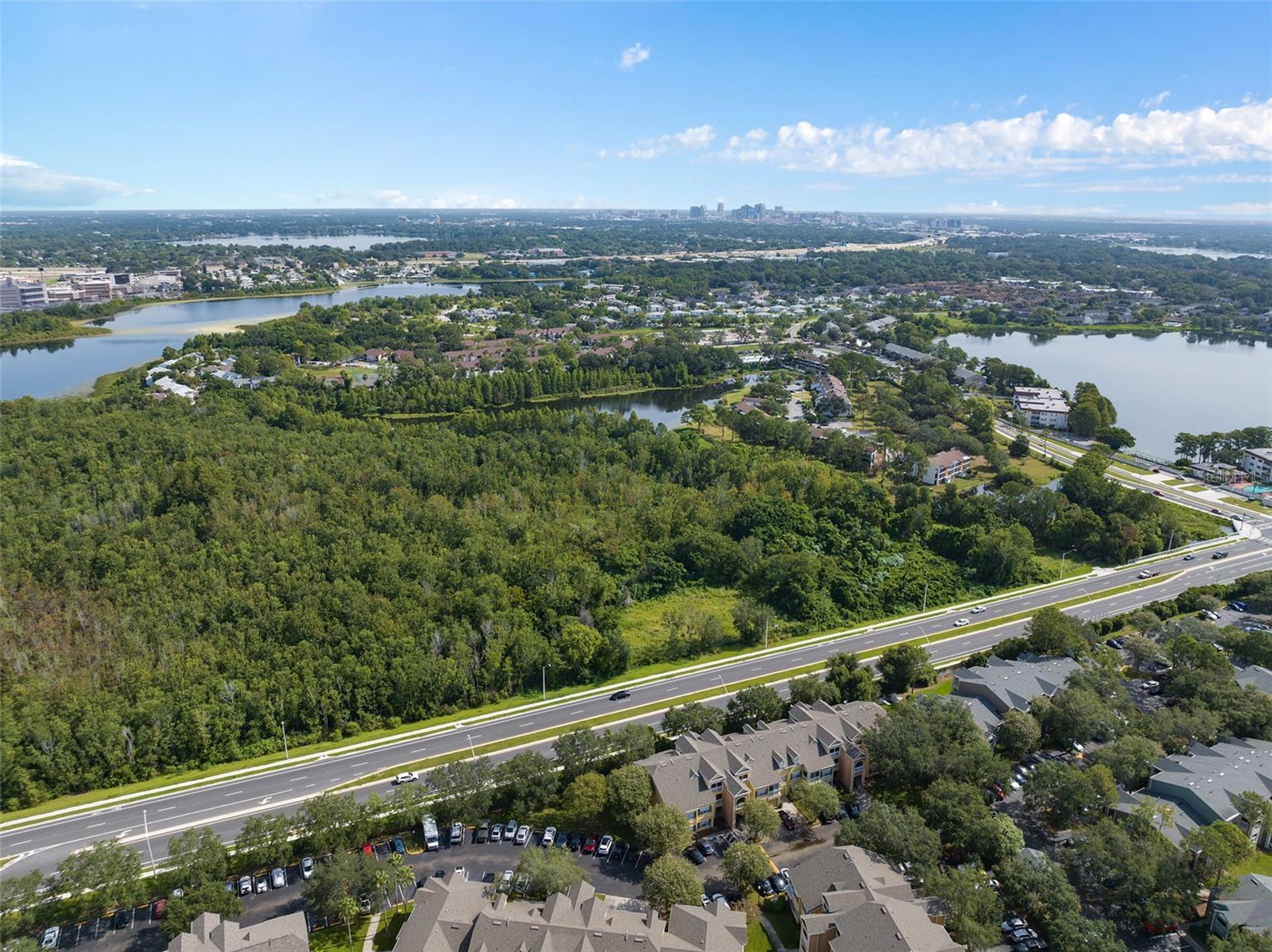 PRIME LOCATION!!! Fantastic opportunity for commercial, multi-family development. Offering 11.94 acres within City of Orlando limits. This is one of the last expansive undeveloped land sites in the highly sought-after Mall of Millenia area. This property is conveniently located along a recently reconstructed $22.5 million roadway project, connecting Holden Ave to Millenia Blvd. Holden Avenue has been beautifully redesigned with enhanced sidewalks and bike lanes. With its prime location near the Mall of Millenia, shopping plazas, entertainment, dining, and multi-family complexes, this property is in a bustling, high-traffic area.