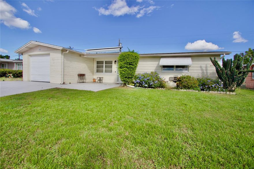 Welcome home got this very affordable move-in-ready 2-bedroom, 1-bathroom home in Holiday, Florida. This home offers comfort, functionality, and lots of potential! With the flexibility to easily convert the enclosed Florida room into a 3rd bedroom, home office, or playroom, this property adapts to your lifestyle. As you drive up this property you are welcomed with beautifully landscaped front yard and oversized driveway that can fit 6 vehicles, leading to a charming shaded front porch with an electric SunSetter awning for added comfort. Inside, you’ll find a bright, open floor plan with natural light and laminate flooring throughout. The spacious kitchen features a 30-handle cabinet layout and a central island—perfect for cooking and entertaining. The full bathroom includes a freshly re-glazed tub and a tub/shower combo, while the entire interior has been freshly painted (January 2025). Enjoy extra living space in the enclosed Florida room, complete with its own wall AC unit. The fully fenced backyard boasts a covered patio, storage shed, and ample room for outdoor relaxation. The UPDATES INCLUDE:Newer 2.5-ton A/C unit, Updated electrical panel (2021), Rain gutters & irrigation system, Fresh interior paint (Jan 2025), Passing 4-point inspection (April 2024). Conveniently located near beaches, shopping, and local amenities, this well-maintained home is ready for its next owner. Schedule your private showing today—at this price in this market it is a bargain.