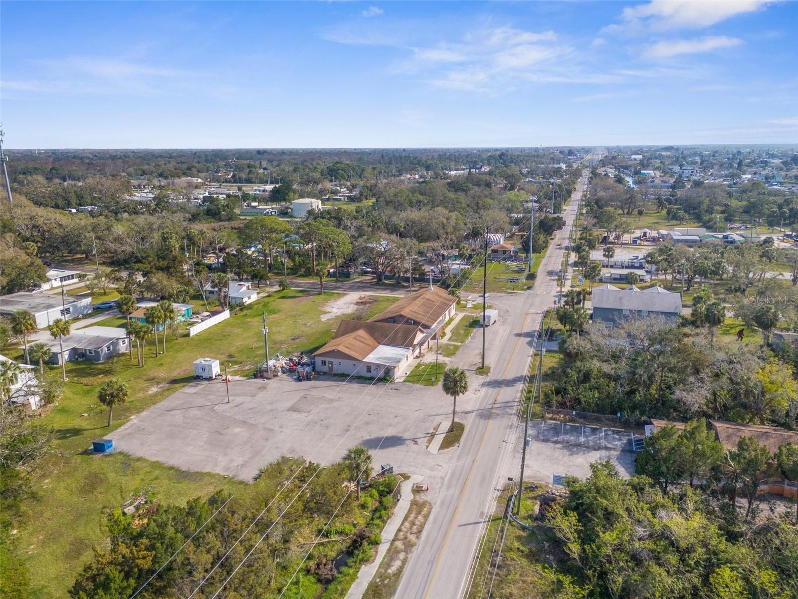 RARE OPPORTUNITY- Property being sold for land value (2 acres). New Owners should be able repair current building if desired, and would need to work with the county. Special zoning use for church expires with the sale of the land. Zoning is R1MH with a future land use of RES-6. Many opportunities with this property! Can be subdivided into 4 lots and place 1 manufactured home on each. Or Res-6 Zoning District (Six Dwelling Units per Acre Maximum). This district allows for development between 5.1 and 6.0 dwelling units per acre according to zoning. The site has 2 septic tanks, only one works. Please do not walk the site without an appointment or licensed agent present.