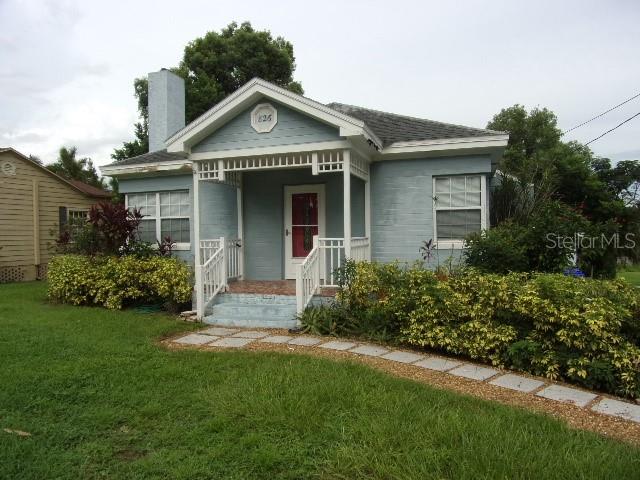 WALK TO LAKE HOLLINGSWORTH. Historic area, adorable 2 bedroom 1 bath home plus a detached 264 sq feet studio. Enjoy all the charm of yesteryear with all the modern updates. Freshly painted interior. Remodeled kitchen with newer counter tops & tile back splash, all updated stainless steel appliances plus an added bonus of a closet pantry. Newer roof. Laminate and hardwood floors throughout. Ceramic tile in the wet areas. Living/Dining room combination. Decorative Wood burning fireplace in Living room. Two bedrooms share a full updated bathroom. Walk out on a paved pathway to the detached studio, perfect for an office, art studio or quest quarters. Washer & dryer are located in the studio, as is for tenants convenience only. Studio has a window AC unit. Come relax and enjoy the serene lake view. Large lot beautifully landscaped. Lawn service is included. Tenants Must Carry Renters Insurance. Call today for your private viewing.