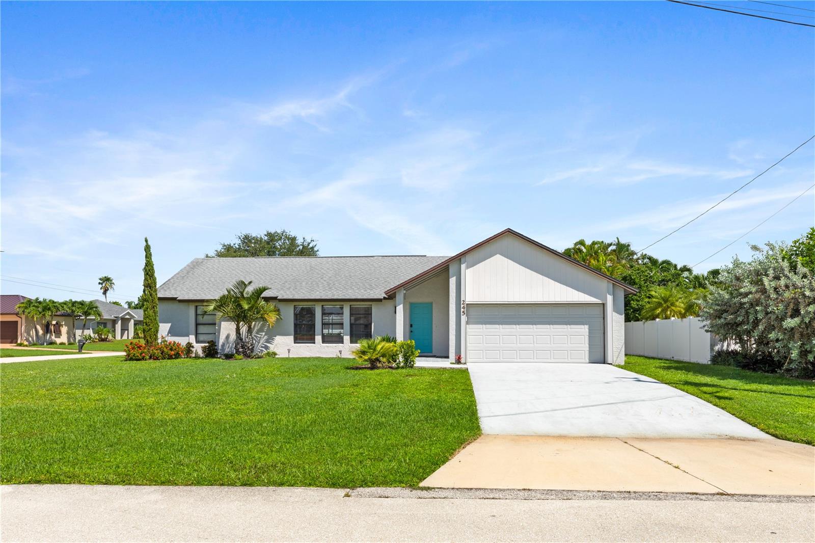 TURNKEY 4 Bedroom, 2 Bathroom, 2 Car Garage, Pool home with a Family room situated on an OVERSIZED CORNER LOT in Cape Coral. CLICK ON THE VIRTUAL TOUR LINK 1 FOR THE VIDEO AND VIRTUAL LINK 2 FOR THE 3D TOUR. Whether you are looking for an investment property, winter get-away or a full time residence this home is sure to suite your needs, featuring a bright and airy floor plan, tile flooring throughout, high vaulted ceilings, recessed lighting and MORE! An open living and dining room make this home perfect for entertaining, with a pass through window to the kitchen. The kitchen offers ALL stainless steel appliances, granite countertops, tiled backsplash, ample countertop space and a breakfast bar. Off the kitchen is a family room where you can expand your living and entertaining space. The spacious master bedroom has a walk-in closet and an en-suite bathroom with a dual sink vanity, a walk-in shower and access to the lanai. The three guest bedrooms are on a split floorplan, providing plenty of privacy, with built-in closets and a shared guest bathroom nearby with access to the lanai. Start your morning with a peaceful cup of coffee or unwind with your favorite evening beverage on the lanai, with plenty of room for entertaining and a private pool for year-round enjoyment. The fully fenced backyard adds extra privacy and security — ideal for pets, children, or simply creating your own private oasis. . Conveniently located close to local shopping & boutiques, fine & casual dining, LIVE entertainment, and a short car ride to award-winning beaches! Schedule your showing TODAY!
