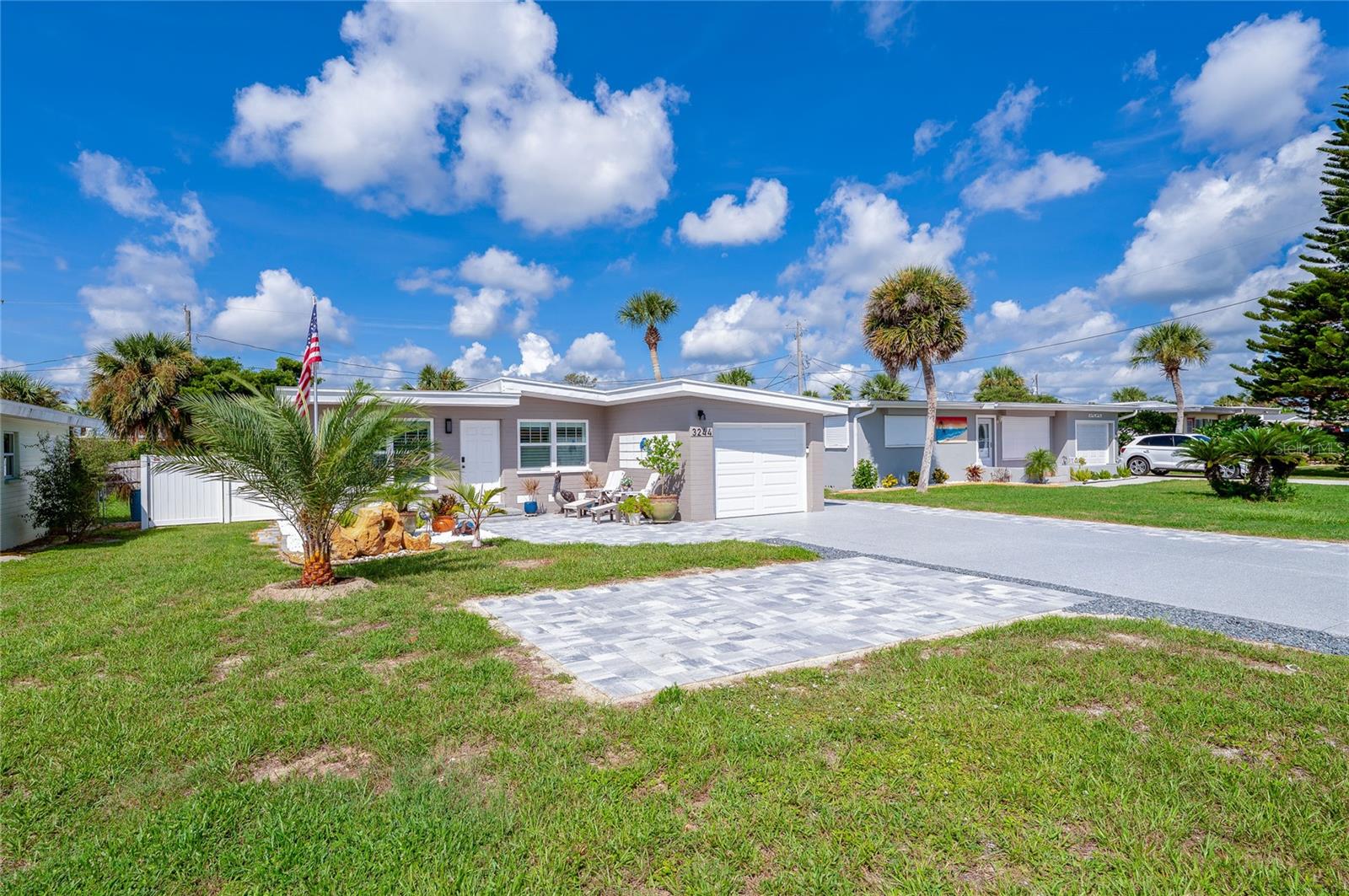Welcome to your beachside oasis in Port Orange! This thoughtfully updated 2-bedroom, 1-bath concrete block home with a new 2024 roof is perfectly nestled between the Atlantic Ocean and the Halifax River, offering the very best of coastal living. Just minutes from the beach, marinas, boat ramps, restaurants, and watersports, it’s the ideal setting for a vacation getaway, short-term rental, or full-time residence in a rental-approved area.
The sellers have taken care of every detail so you can move right in with confidence. Major upgrades include impact windows and doors, a Generac 22kW whole-house generator, brand-new Carrier HVAC system, Rinnai propane tankless water heater, electrical and plumbing updates, and a Clopay wind-code garage door. Inside, you’ll find luxury vinyl plank flooring, granite counters, newer GE appliances with warranty, plantation shutters, and a beautifully renovated tile shower. At the heart of the home, the kitchen shines with a large island perfect for gatherings and entertaining, making it the ultimate space for friends and family. Added comforts such as a Wi-Fi thermostat and full security system provide modern convenience and peace of mind.
Curb appeal and function meet out front with an expanded driveway, additional parking patio, and paver courtyard. In back, your private retreat is enclosed by a new vinyl privacy fence and enhanced with concrete and pavers, offering plenty of space for your RV, boat, or trailer—a rare find this close to the beach. To make the transition even easier, the furniture can be negotiable.
And when it’s time for fun, you’ll be only minutes from Daytona’s world-famous events like the Daytona 500, Bike Week, Biketoberfest®, and Jeep Beach. This home truly checks all the boxes for enjoying the ultimate Florida coastal lifestyle, while still being convenient to shopping, hospitals, and schools. Whether you’re seeking a relaxing home base, a vacation retreat, or a rental-friendly property, this one offers it all.