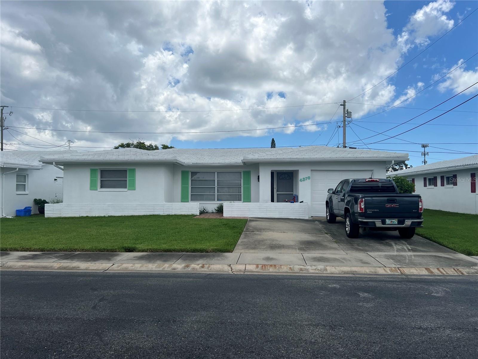 Welcome to your beautifully updated retreat in the desirable 55+ community of Mainlands of Tamarac by the Gulf! This charming 2-bedroom, 2-bathroom single-family home offers approximately 1,598 sq. ft. of thoughtfully designed living space, including a split floor plan with a separate living room, dining room, and family room — perfect for entertaining or relaxing in comfort. The roof was replaced in 2022, ensuring peace of mind for years to come. You’ll also enjoy the convenience of a one-car garage with washer and dryer hookup. Living here means embracing a low-maintenance lifestyle, with the HOA covering internet, TV, lawn care, roof maintenance, and even pressure washing, so you can spend more time enjoying all the community has to offer. Community amenities include: Multiple clubhouses hosting social events and activities. Outdoor pools and sundecks for year-round enjoyment. Shuffleboard courts, walking & biking paths. The Mainlands Golf Course — an 18-hole public course with pro shop and restaurant. Perfectly located near shopping, dining, and entertainment, this home also offers easy access to Clearwater, St. Petersburg, and Tampa — with Tampa International Airport just 25 minutes away. Don’t miss your chance to own this move-in ready, meticulously maintained home in one of the area’s most vibrant and welcoming 55+ communities. Schedule your private showing today and start living the Florida lifestyle you’ve been dreaming of!