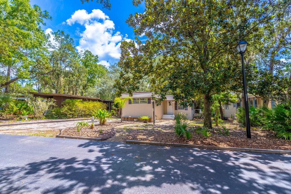 Welcome to The Forest – Lake Mary’s Best-Kept Secret! This spacious 2-bedroom, 2-bath home is located in The Forest, a highly sought-after 55+ gated community in the heart of Lake Mary. With an unbeatable location just one mile from I-4 and a short walk to shopping, dining, and the Seminole Wekiva Trail, convenience is right outside your door. Step inside to find a generously sized living room and an enclosed Florida room with windows all around, filling the space with natural light and offering a peaceful retreat or bonus living area year-round. The Forest is known for its resort-style amenities, including two large pools—one heated and the other Olympic-sized—a hot tub, men’s and women’s saunas, tennis/pickleball and shuffleboard courts, and a dedicated RV/boat storage area available for a nominal fee. Social life thrives here with a stunning clubhouse featuring floor-to-ceiling windows overlooking the natural setting and the pools. The community also includes a second gathering building perfect for smaller events, card games, and get-togethers, with a convenient coin laundry facility for residents, a poker room, a craft room, a billiard room, and a resident library. With a calendar full of planned activities such as shuffleboard, dominoes, card games, water aerobics, and pool volleyball, there’s always something to do and friendly neighbors to enjoy it with. If you’re looking for a vibrant, active lifestyle in a peaceful and beautifully maintained community, this is the home you’ve been waiting for. Schedule your private showing today and discover why The Forest is the best-kept secret in Lake Mary!