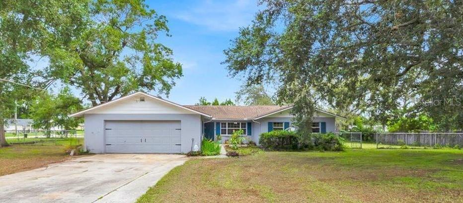 One or more photo(s) has been virtually staged. Welcome to this charming SPACIOUS 4-bedroom, 2-bathroom home situated on a LARGE CORNER LOT with a FULLY FENCED BACKYARD—perfect for entertaining, pets, or adding a FUTURE POOL! Inside, you'll find a SPACIOUS, UPDATED KITCHEN with GRANITE COUNTERTOPS and AMPLE CABINET SPACE—ideal for the home chef. The PRIMARY BEDROOM FEATURES TWO CLOSETS and a PRIVATE ENSUITE BATHROOM with a WALK-IN SHOWER. Enjoy peace of mind with a NEW WATER HEATER (2024) and a HOME WARRANTY INCLUDED for added protection. The FOURTH BEDROOM offers flexible space, and the SELLER IS CONTRIBUTING $2,500 TOWARD BUYER'S CLOSING COSTS—WHICH CAN ALSO BE USED FOR FLOORING UPDATES IN THAT ROOM. The GARAGE INCLUDES A WORKSHOP AREA—perfect for hobbies or extra storage. Conveniently located near Historic Downtown Dade City, shopping, dining, schools, and area attractions.