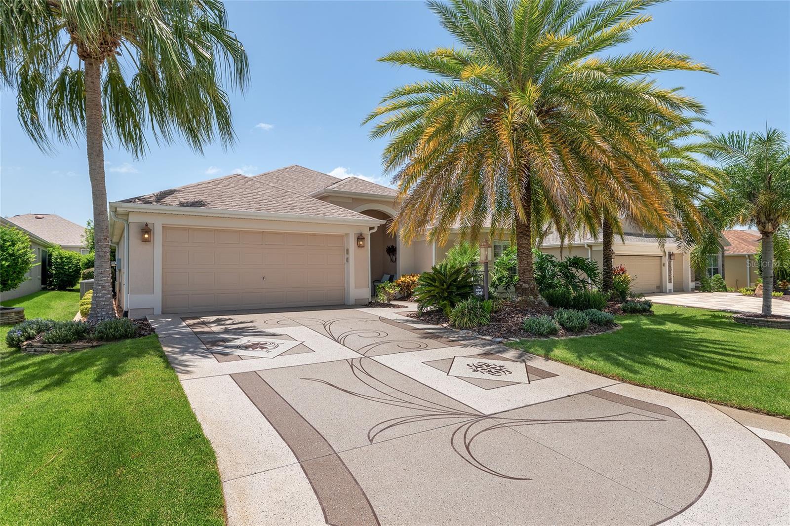Don’t Miss This One! – Lantana - BOND PAID! – NEW ROOF 2024! - Quiet Cul Du Sac Location, ALL Block & Stucco Homes on the Street! Minutes to Brownwood in Collier – Mature Landscaping framed with stacked walls adds to the road appeal! The rear of the home has absolute privacy! Conveniently located between Evans Prairie Country Club with a Priority Pool, Sweetgum and Mangrove Executive Courses with Big Cypress & Eisenhower Rec Centers close by! This popular Lantana model has a Custom Drive and Walkway, plus an Expanded 26' Deep Garage with a Power Screen!
Step inside the leaded glass door to the tile foyer complete with a coat closet! You have a formal dining area to the left (currently used as a sitting area) The custom kitchen with features stainless refrigerator and dishwasher plus a smooth top range, granite counters, maple glazed cabinets featuring a built-in wine rack. From the large carpeted great room, you enter the enclosed lanai through a full stacking patio door. This creates a very open atmosphere when entertaining. The party can flow outdoors onto a very private patio. The large primary suite has with a tray ceiling creates a very private space. The large walk-in closet is finished nicely with closet organizers. As you would expect, the primary bath features raised counters, dual vanities, private commode and a Roman shower. The two guest bedrooms and bath with a tub are up front. Both bedrooms have closets with custom closet organizers and ceiling fans. You will notice right away the many quality additions such as plantation shutters, closet organizers in all closets and 6” baseboards throughout the home.
The garage is expanded to 26’ in length giving extra space you will love. In addition, the garage with an epoxy floor has professionally built cabinets for storage and pull-down attic storage space. What are you waiting for? See it today! For an added benefit a limited home warranty is being provided!