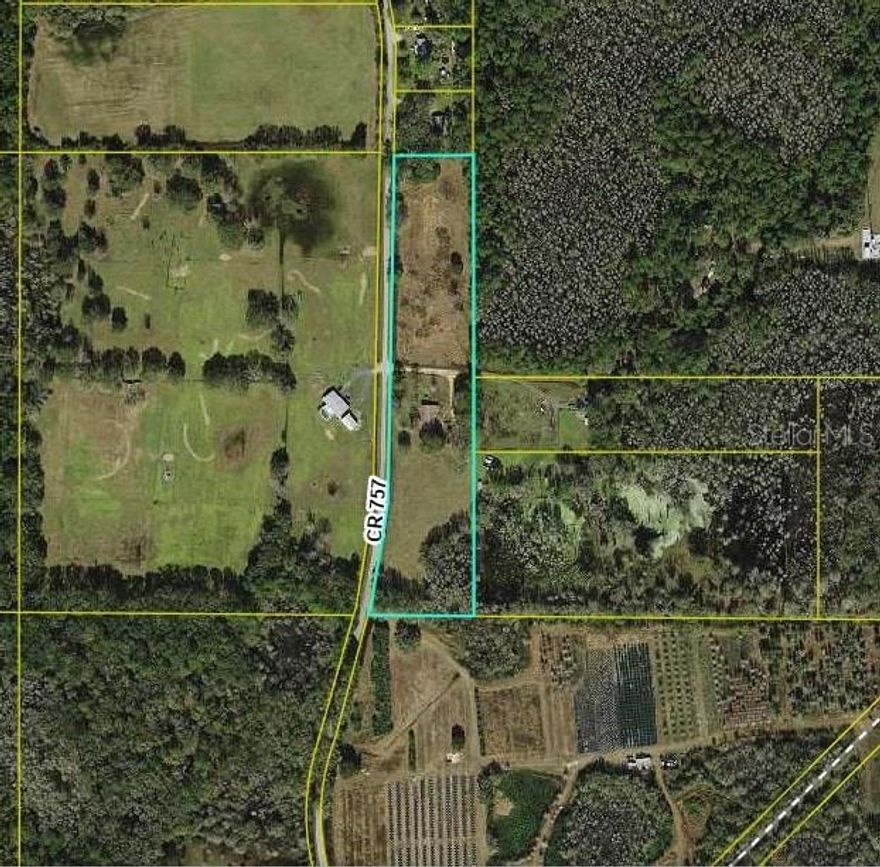 This 7.7 acre lot is partly fenced and has a mobile home on it that does need some repair. Also has a deteached garage the needs work done on the concrete floor.