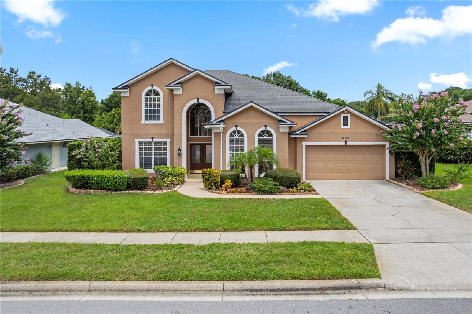 One or more photo(s) has been virtually staged. Welcome to this 4 bed/3 bath home in the highly sought-after Timacuan Golf Community! This beautifully updated executive-style home will have a BRAND NEW ROOF INSTALLED PRIOR TO CLOSING for added peace of mind. The owners also installed a NEW High Efficiency Carrier AC for maximum comfort and savings. From the moment you enter through the double doors and into the grand 2-story foyer, you'll be impressed by the spacious, light-filled layout, REAL WOOD FLOORING, and CROWN MOLDING in every room. The formal living and dining rooms up front provide elegant spaces for entertaining or one could easily serve as a home office.**Stylish tile floors lead you to the expansive family room and open-concept GOURMET KITCHEN, which overlooks the sparkling SALTWATER POOL with a Newer variable speed pump and a covered lanai. NO REAR NEIGHBORS create a private oasis.** The kitchen features granite countertops, a center cook island with a downdraft fan, a snack bar, breakfast nook, BUILT IN OVENS, and newer appliances—including a NEW cooktop, NEW dishwasher, and Newer refrigerator (2 yrs).**The luxurious primary suite is located on the first floor with views of the the pool and backyard. The Master boasts NEW CARPET, volume ceilings, an expansive walk-in closet, soaking tub, dual vanities, and a separate shower. Next to the Master is the full-size pool bath with an updated vanity top and a tiled shower for added convenience.**Upstairs, you’ll find three generously sized bedrooms, each with crown molding, LARGE CLOSETS, and plenty of natural light. A LARGE LOFT provides flexible living space, while the thoughtfully designed Jack and Jill bathroom includes two separate sink areas and a shared shower separated by 2 doors for added privacy.**Additional highlights include DOUBLE PANE WINDOWS, NEWER SLIDING DOORS in the family room & kitchen, wooden blinds, ceiling fans in nearly every room, crown molding throughout, and lush landscaping with a sprinkler system.**This immaculate home offers comfort, functionality, and style—all in a prime location and with a NEW ROOF COMING SOON. Don’t miss your opportunity to own this exceptional property in one of Lake Mary’s premier golf course communities!