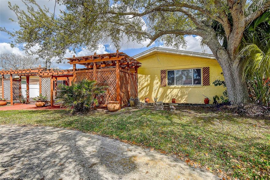 Welcome to your own WATERFRONT OASIS with this SPARKLING SWIMMING POOL — set on a tranquil CANAL JUST MINUTES TO THE OPEN GULF WATERS! The ultimate Florida retreat. NEW ROOF 2024, NEW POOL SURFACE 2022, new seawall 2009, new floating dock 2025, updated WINDOWS, tankless water heater – all give you peace of mind! Step inside to a light and bright interior with plenty of updated windows letting the natural light in. The updated kitchen features GRANITE COUNTERTOPS, stainless steel appliances, and offers a breathtaking view of your in-ground pool and canal! The SPLIT BEDROOM PLAN offers privacy for all. The large master suite offers a private retreat with ensuite bathroom, while two additional bedrooms provide flexible space for guests or a home office.  Two of the 3 bedrooms are very spacious (15x11) and one is perfect for guest room or as home office (11x11). Convenient inside laundry closet in one of the bedrooms. You’ll love your private backyard oasis—complete with a sparkling in-ground pool and serene water views. Love to entertain - You’ll be right at home with the screened-in pool enclosure  surrounded by lush palm trees and tropical landscaping that provide the ultimate privacy along the seawall. There are 3 extra sitting areas – a covered patio with insulated roof where you’ll enjoy the breeze and sip your morning coffee, outdoor paver area, an additional screened porch on the side, and even a poolside kitchenette—perfect for hosting friends and family year-round. This private dock extends its embrace over the sparkling waters, creating an idyllic retreat for water enthusiasts and those seeking a connection with the great outdoors. Best of all—no HOA, no CDD! Circle driveway for plenty of parking space! Tool shed on side. Whether you're looking for a full-time residence, seasonal escape, or a turn-key short-term rental investment, don’t miss your chance to own this move-in-ready, fully furnished waterfront oasis!