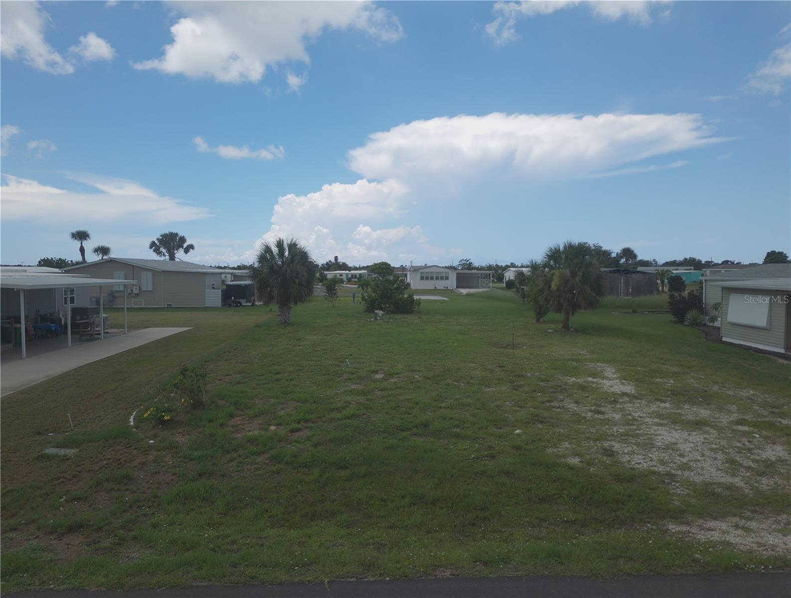 Don't miss your opportunity to purchase a vacant mobile home lot now available in the well-established Holiday Mobile Estates, a 55+ community in Englewood. Close to shopping, restaurants and beaches, you will not be disappointed with this highly desirable lot! This homesite was previously developed, which may reduce utility hookup costs. The lot is cleared and ready for a new manufactured home. Membership to the Edgewater Club offers access to a heated community pool, tennis, pickleball, shuffleboard, bocce ball, social events, and more, for approximately $300/year. The neighborhood is pet-friendly and golf cart accessible, with low fees and evident pride of ownership throughout. Conveniently located just minutes from shopping, dining, medical facilities, and less than 4 miles to Englewood Beach. Whether you're looking for a seasonal retreat, year-round residence, or long-term investment, this lot presents an excellent opportunity.