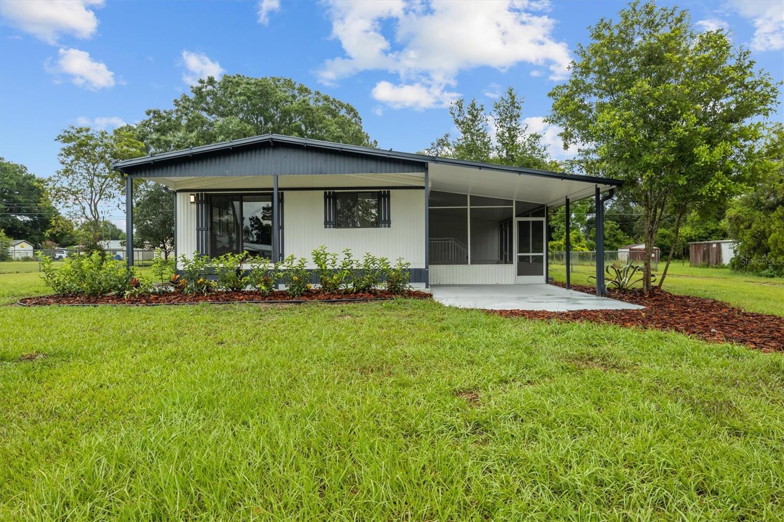 This beautifully updated 2-bedroom, 2-bath home is move-in ready! Situated on over half an acre, it offers the perfect blend of modern upgrades and comfortable living.
Inside, luxury vinyl plank flooring runs throughout, setting the stage for a bright, open layout. The brand-new kitchen features quartz countertops, stainless steel appliances, and a spacious island with seating for three. It flows seamlessly into the oversized family room, perfect for entertaining or everyday living. Even more charm is added with its electric fireplace and custom accent wall.
The primary suite is a true retreat, complete with a bold accent wall, ample space, and a fully renovated en-suite bath. The second bedroom is generously sized, and the guest bathroom has also been updated with new fixtures and finishes.
Every detail has been thoughtfully redone, from lighting to appliances—all included—making this home truly move-in ready. With plenty of outdoor space and a stylish interior, this one won't last long. Come see it today!
American Home Shield Warranty available.
**Seller is a licensed real estate Broker/Owner**
Seller may contribute to closing costs if preferred lender is used.