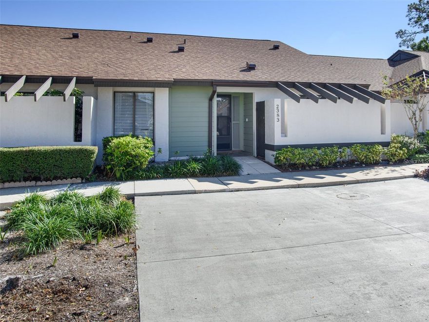 Nestled in a peaceful setting within the serene Cedarwood Village community, this charming one-story Winter Park condo offers a quiet retreat away from traffic noise, with a rear wooden fence for no visible neighbors for added privacy. The spacious 27-foot tiled and enclosed lanai creates the perfect place to relax and enjoy the tranquil surroundings. Cedarwood Village also offers low-maintenance living, with lawn care included in the HOA, along with amenities such as rebuilt tennis courts, a recently remodeled pool, a clubhouse, dog-walking areas, and newly paved roads. Conveniently located in a highly rated school district and close to shopping, dining, and entertainment, the property is also just minutes from Full Sail University, Valencia College, and UCF.
Inside, the condo is beautifully updated and shows the care of meticulous owners. The modern kitchen features granite countertops, matching cabinetry, and an eat-in area with sliding doors leading to the private patio, while the bathrooms and dining room wet bar are finished with the same stylish cabinets and granite. The split floor plan includes tile flooring throughout the main living areas and wood floors in the bedrooms. The large living and dining spaces feature vaulted ceilings with skylights for abundant natural light, along with a cozy wood-burning fireplace. French doors from the living room open to the enclosed lanai, while the primary suite also has direct lanai access, ample closet space, and a private bath with both a tub and shower. Additional features include an interior laundry closet adjacent to the kitchen, updated plumbing, a roof replaced in 2018, new ductwork installed in 2023, and a $4,500 seller credit at closing toward a new AC. Two assigned parking spaces are located directly in front of the unit. Tenants will be moving out May 31, 2026.