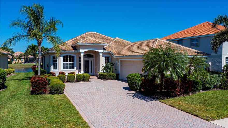 One or more photo(s) has been virtually staged. Now is your opportunity to own this beautifully maintained 2-bedroom, 2-bath home with a den and tranquil pond views in the highly sought-after, guard-gated community of Stoneybrook at Venice.

From the moment you arrive, the home’s charming curb appeal stands out — featuring a side-load garage, pavered driveway, and tropical landscaping. Inside, you’ll find high ceilings, plantation shutters on all windows (except the sliders and aquarium-style window, both of which have a protective tint), and tile flooring, creating a bright and open feel.

The spacious den, with double-door entry, built-in shelving, and a cozy window bench, makes the perfect home office, library, or hobby room — offering flexibility to suit your lifestyle.

The foyer opens to a large great room, where a wall of sliding glass doors leads to the oversized screened lanai overlooking the serene pond — seamlessly blending indoor and outdoor living. The dining area features an aquarium-style window that fills the space with natural light and showcases beautiful water views.

The kitchen is sure to impress the chef with ample cabinetry, maple wood finishes, stainless steel appliances, and generous counter space. A large breakfast bar connects to the living area for easy entertaining, while a light-filled breakfast nook is perfect for morning coffee — all while taking in tranquil pond views right from the sink.

The primary suite is a peaceful retreat, featuring a vaulted tray ceiling, water views, and a spa-inspired en-suite bathroom with dual vanities, a deep soaking tub, walk-in shower, and private water closet. The spacious walk-in closet offers ample storage and organization.

Both bedrooms feature rich walnut luxury vinyl flooring, adding warmth and elegance throughout the home.

A private guest bedroom and second full bath are located on the front side of the home, creating the perfect layout for comfort and privacy. The laundry room, located just off the garage, includes a brand-new washer and dryer and additional cabinet storage. The garage also includes a convenient spare sink — ideal for cleanup after gardening or projects.

Step outside to your own slice of paradise — the large, covered lanai with screen enclosure offers plenty of space to relax, entertain, and enjoy beautiful views over the pond. The lanai includes roll-down shutters for convenience, while metal hurricane shutters are neatly stored in the garage for peace of mind.

Additional upgrades include a new HVAC system (2023) and a new roof (2024) with a 30-year warranty, providing lasting value and reassurance for the new homeowner.

Residents of Stoneybrook at Venice enjoy resort-style amenities, including a community pool and spa, tennis and pickleball courts, basketball court, sports field, fitness center, and more. Ideally located near historic downtown Venice, Venice Beach, and the vibrant Wellen Park town center — where you’ll find restaurants, shopping, live music, a weekly farmers market, and a large lake for kayaking and canoeing. With easy access to I-75 and proximity to CoolToday Park, home of the Atlanta Braves spring training, this location truly captures the essence of Florida living.

If you’ve been dreaming of your own piece of paradise, don’t wait — schedule your private showing today and experience this move-in-ready gem for yourself!
