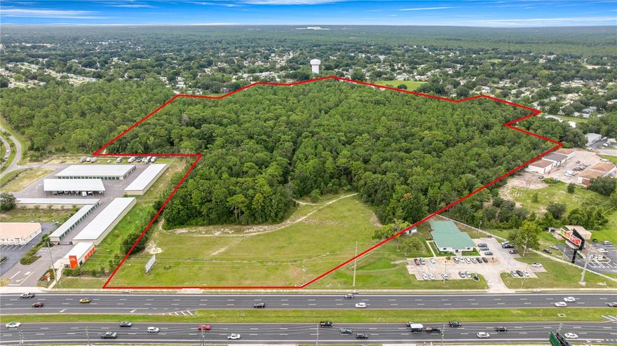 Where Ocala’s Growth and Opportunity Meet! This prime development tract, generationally owned and unavailable to purchase for nearly four decades, is now on the market! Don’t miss this rare opportunity to secure 43.38 +/- acres (from survey) of high-visibility land along thriving SW Hwy 200. Zoned PUD, the property sits contiguous to Oak Run Country Club, a thriving Age Qualified Active Community of 3,478 single family homes. Notably, and uniquely positioned, this parcel offers a designated interior access point for the homeowners of this community to enter the parcel directly without ever having to utilize SR200.  Strategically located in one of Marion County’s most active growth areas, this exceptional site  offers outstanding commercial, mixed-use, or retail development potential. The property features excellent frontage on a major traffic artery and is surrounded by extensive shopping, dining, and service amenities.  The area boasts strong demographics, above-average rooftop counts, and close proximity to several more age-qualified communities. With its combination of size, accessibility, and market exposure, this parcel is ideally suited for a landmark project in a high-demand location.