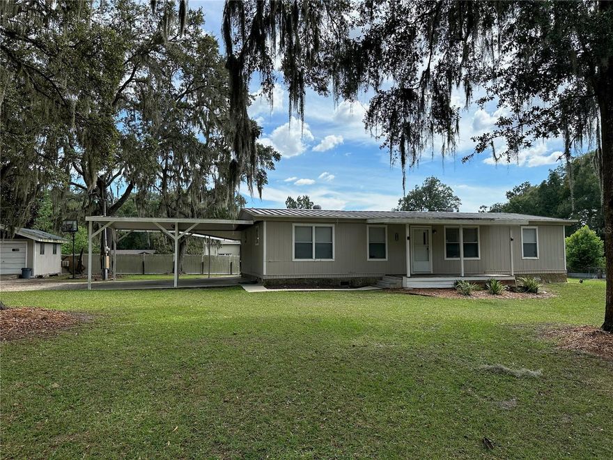Come check out this meticulously maintained 3 bedroom, 2 bathroom mobile home located just off Hwy 301! This home sits on a beautiful oversized lot with mature oaks and has plenty of room to park your trailer, boat and other toys. Improvements to the home include new A/C in 2022, new flooring throughout and new stainless steel appliances. The property also features a two car carport, covered front porch, screened in patio and a shed for extra storage, all of which are under a metal roof! The home's location provides very convenient access to Ocala, Belleview and the Villages. OWNER FINANCING AVAILABLE: 10% down, 10.9% Interest, 20 yr Amortization, 5 year adjustable rate, Payments = $1,384/mo plus $20/mo collection fee. Buyer pays all closing costs on Owner Finance Purchases. Room measurements are approximate. Buyer should do their own due diligence.