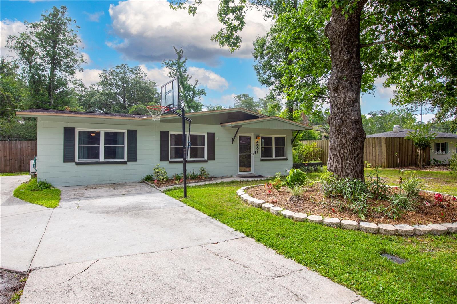 This FULLY renovated 3/2+bonus room is everything you’ve been searching for! Featuring a new HVAC (2022), new water heater (2022), all new windows (2020), blown in attic insulation (2020), a recently added concrete patio and screened porch (2018), a newer roof (2017), a full repipe, and MORE! Located in the heart of the home, the custom kitchen boasts granite countertops, stainless steel appliances, and all wood cabinetry; all while overlooking your oversized living room and stately fireplace. While the inside is incredible, the backyard competes for the best part of this property! Throw a BBQ on your large concrete pad, relax in your recently installed 14x14 screened porch, live off the land with your herb/vegetable garden and multiple producing fruit trees, or watch your fur babies run free in your fully fenced backyard. Storage will never be an issue as well with two large sheds that the sellers are leaving for the new owners. Enjoy low-cost living with a concrete block home and no HOA, all while being in the center of town with high speed, fiber optic AT&T internet. With over 40 years of ownership by the current owners, pride is exuded through meticulous and thoughtful care in every aspect of the home. No details were left undone to create the perfect blend of luxury, convenience, and affordability. Call today to schedule your showing!