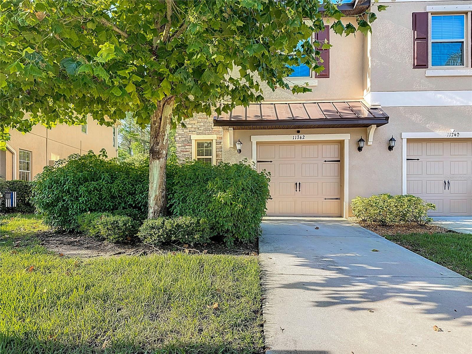 Welcome to this beautifully maintained 3-bedroom, 2.5-bath corner unit townhome, built in 2020, offering the perfect blend of comfort, style, and resort-style living. Nestled in a secure gated community, this home is flooded with natural light and boasts no rear neighbors, giving you peaceful preserve views from both the living room and upstairs primary suite. Step inside to discover ceramic tile flooring throughout the first floor, with luxury vinyl plank on the staircase and entire second level—no carpet! The spacious, open-concept kitchen features granite countertops, stainless steel appliances, and ample cabinet space. Upstairs, you'll find a dedicated laundry room with washer and dryer included, and an abundance of storage space, including built-in storage in the garage. Enjoy the outdoors year-round with a screened-in porch and a backyard deck, perfect for morning coffee or evening relaxation. Community amenities include: Basketball court, two community pools, game room with pool tables, theater room, gym, private boat ramp, and playground all designed to offer a true resort-style living experience just outside your door! Don’t miss this opportunity to own a move-in ready home. Schedule your private tour today!