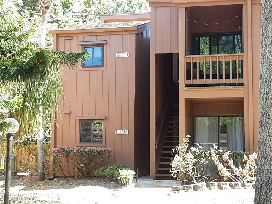 An incredible opportunity to own your next home in the gated community of One Thousand Oaks. This cozy 2 bed 2 bath end unit condo is located on the ground level with calming natural views. This home is completely move-in ready and features a split bedroom floor plan and a spacious, semi-open concept in the main living spaces. The updated kitchen includes sprawling granite countertops with beveled edges, luxurious solid-wood cabinets complete with lazy Susan and soft-close drawers and doors, and elegant stainless-steel appliances including a Whirlpool refrigerator with French doors and large freezer drawer. Next to the kitchen, you’ll find the dining area, and the mirrored dining room wall really amplifies all the natural light in this home--visually it doubles the square footage of this space. The living room with beautiful ceramic tiles is quite large too and has a working fireplace and opens to not just one but two sets of sliding glass doors leading to the screened-in porch. The result is an effortless transition from the indoor entertainment space to the outdoor living space, which doesn’t just look great, it’s thoughtful, integrated, and in harmony with our beautiful Florida climate. As for the two bedrooms, these are both excellent sizes as well and each bedroom features an ensuite bathroom and tons of closet space, so there’s ample storage in this home. The monthly fee covers all exterior maintenance and landscaping, water, sewer, and trash services. Check out the clubhouse, resort-style pool, tennis courts, and of course the lush oak trees everywhere you turn. One Thousand Oaks is located in the heart of South Downtown Orlando, or SoDo as it’s affectionately called, and is very close to everything: grocery stores, restaurants, LA Fitness, Target, and so much more. Needless to say, this home is ready to welcome its next family. Contact us today to schedule a tour!