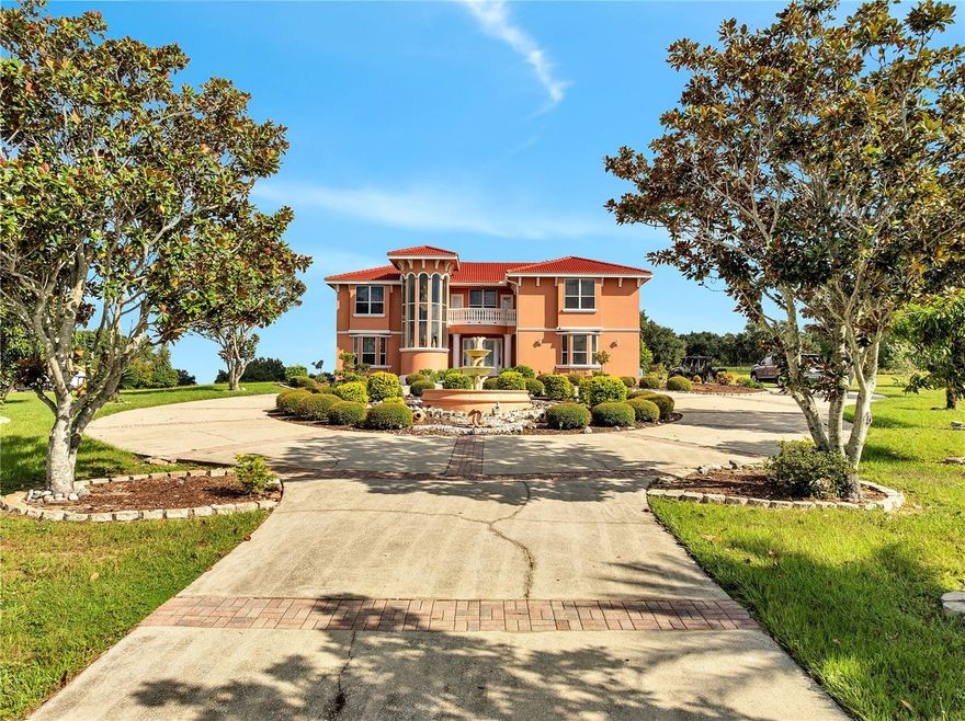 Welcome to 18147 Coralwood Ln, a luxurious estate on 4.63 acres in Groveland, offering elegance, space, and convenience.
From the moment you arrive, the impressive entry with a water fountain sets the tone. The expansive driveway allows parking for multiple vehicles, making every arrival seamless. Inside, the home blends warmth and sophistication with beautiful hardwood floors in select areas, a cozy fireplace, and immaculate finishes throughout. The open layout creates bright, inviting spaces designed for everyday living and entertaining. Outdoors, enjoy your private retreat with a sparkling pool, surrounded by serene acreage that gives you both privacy and room to breathe. Located just minutes from the Florida Turnpike, this property combines the tranquility of country living with quick access to Orlando, shopping, and Central Florida’s attractions. Move-in ready and maintained to perfection — this is more than a home, it’s a lifestyle.